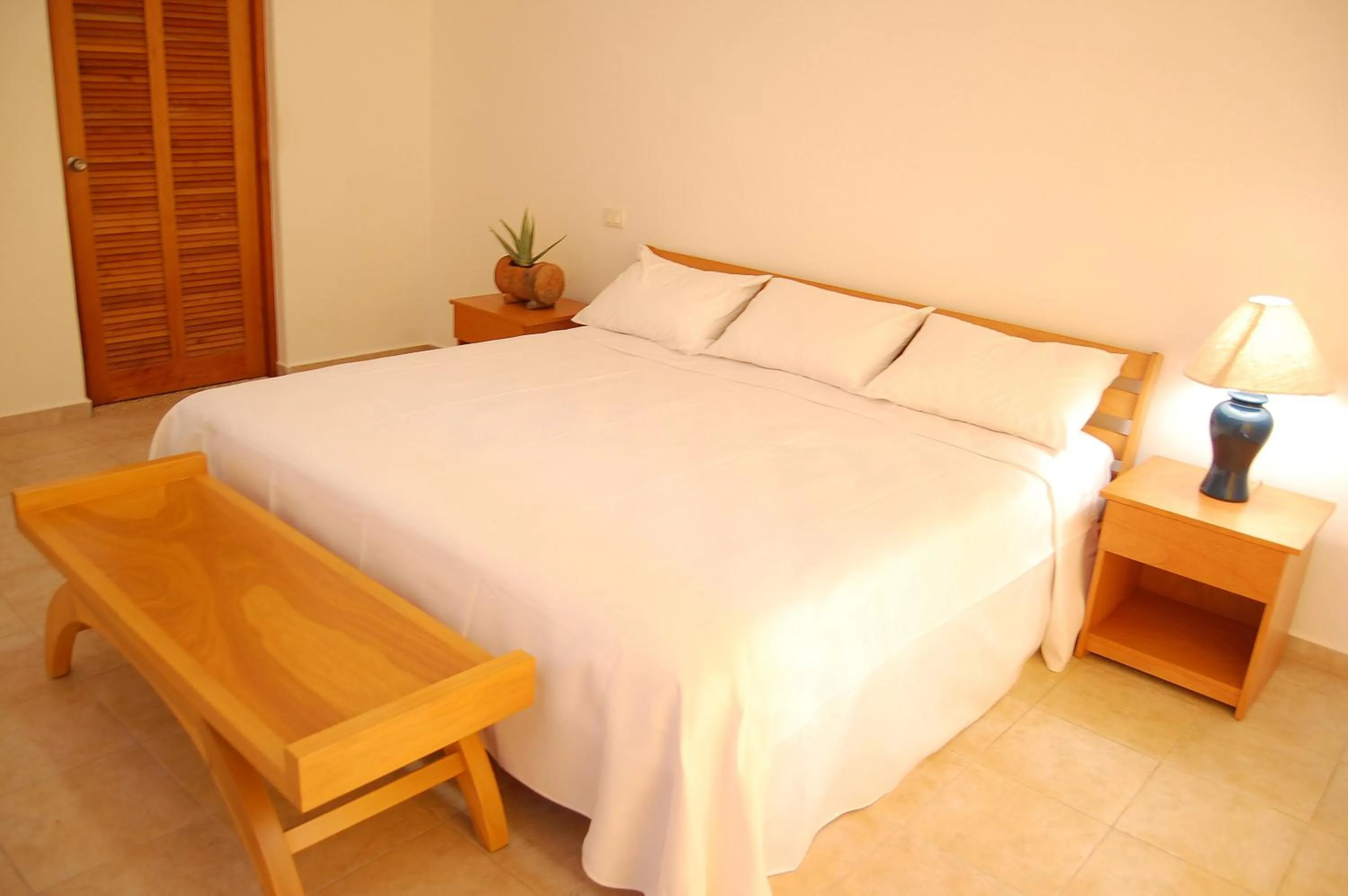 Bed in Villas Mayaluum Cozumel