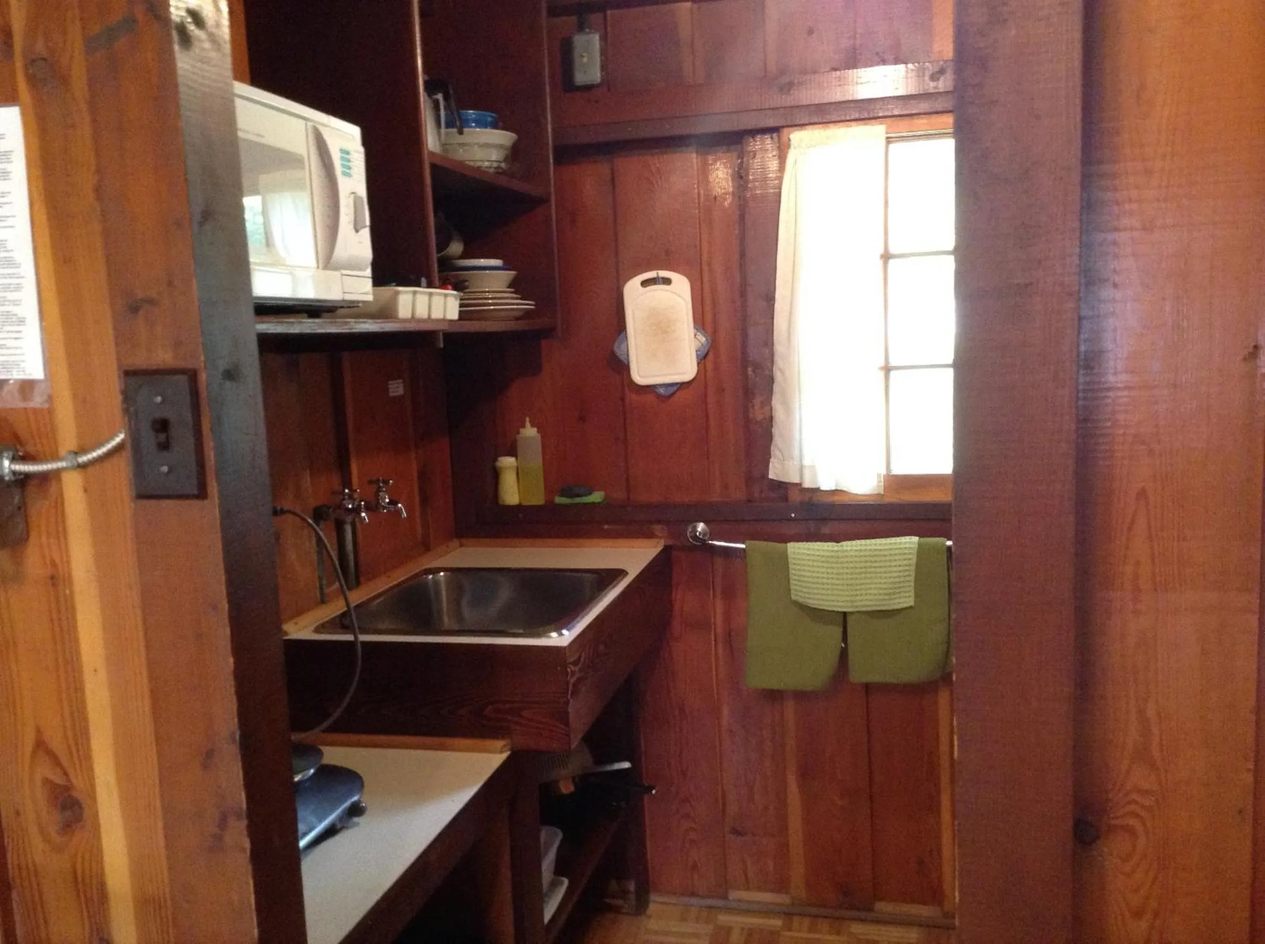 Kitchen or kitchenette in Addison's Bungalows