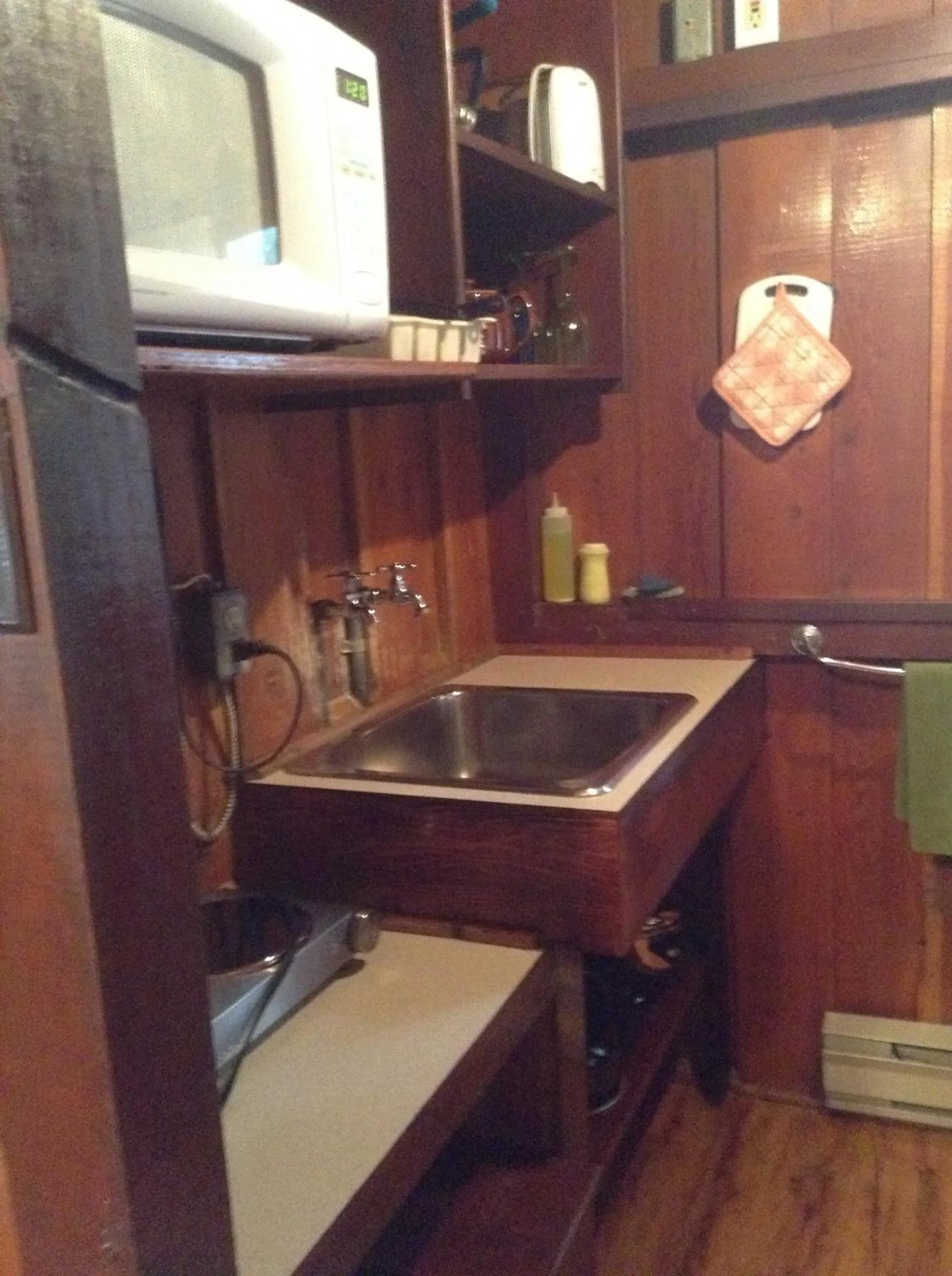 Kitchen or kitchenette in Addison's Bungalows