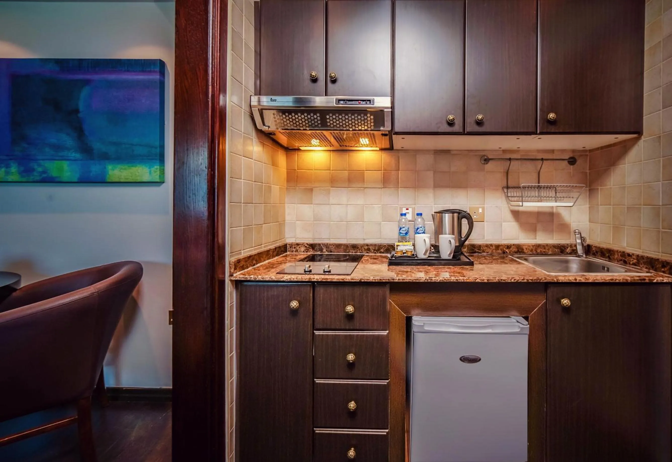 Coffee/tea facilities in First Central Hotel Suites