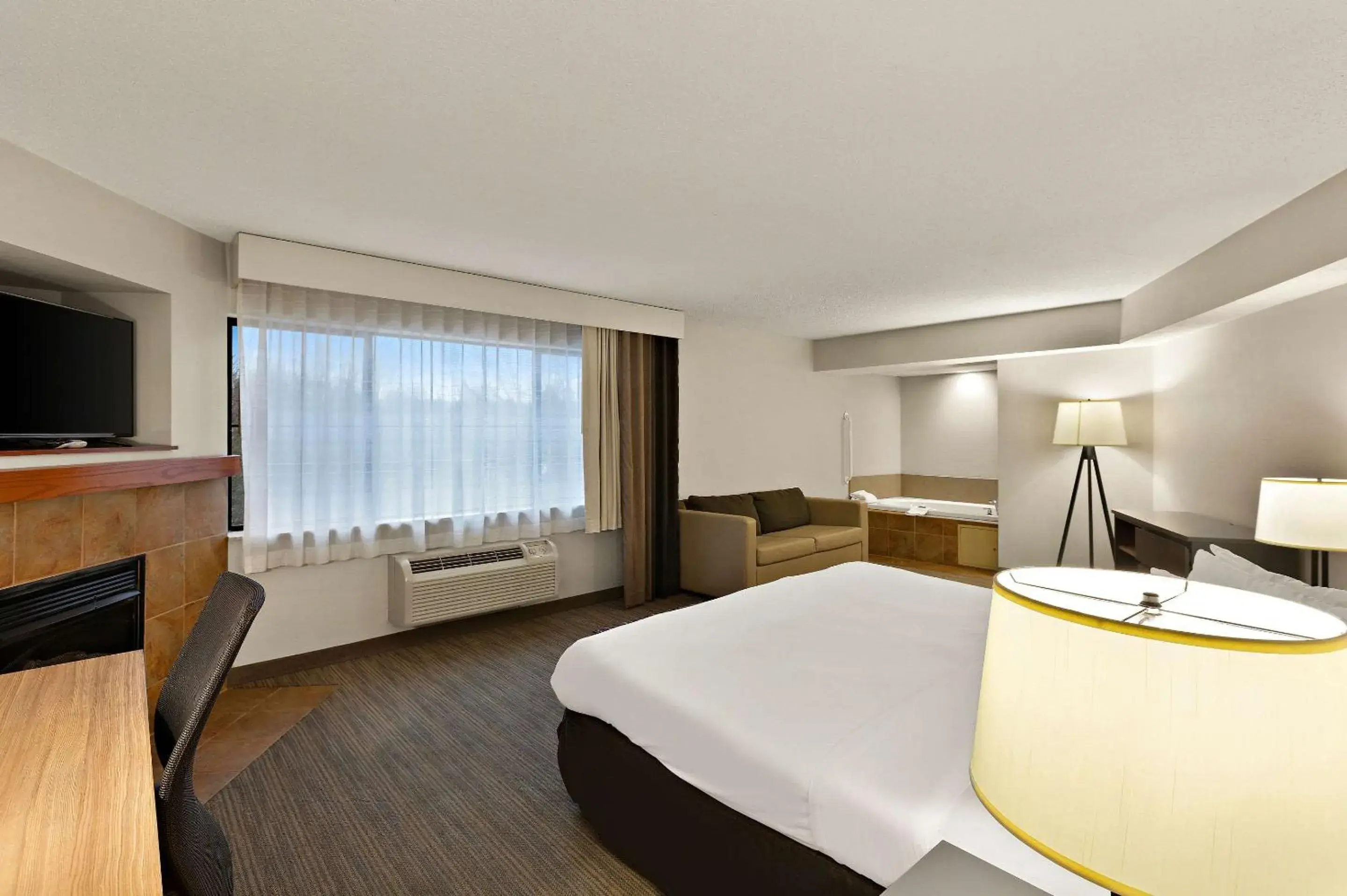 King Suite with Whirlpool and Roll-in Shower in Country Inn & Suites by Radisson, Jonesborough-Johnson City West, TN King Suite with Whirlpool and Roll-in Shower in Country Inn & Suites by Radisson, Jonesborough-Johnson City West, TN