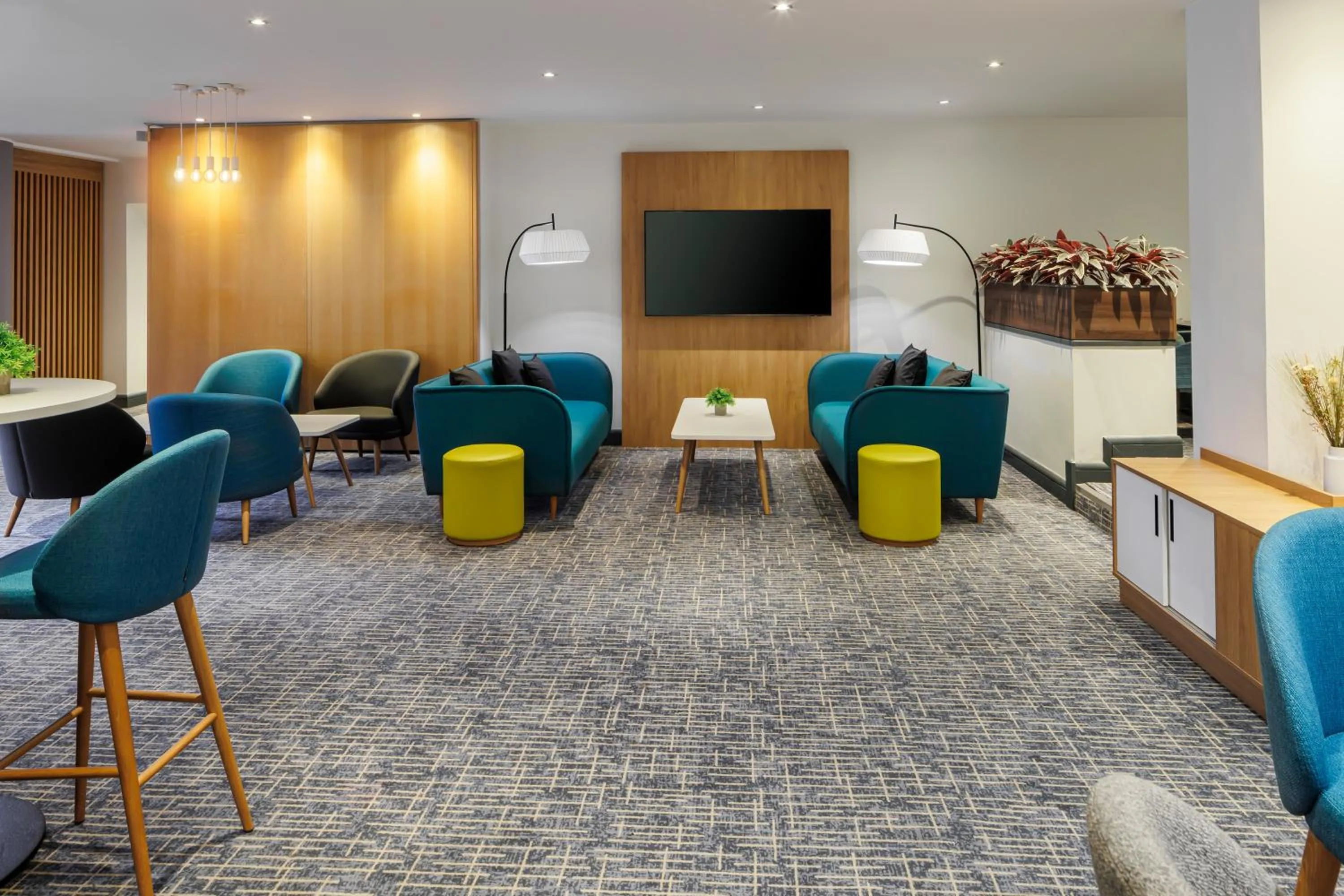 Communal lounge/ TV room in Holiday Inn High Wycombe M40, Jct.4 by IHG