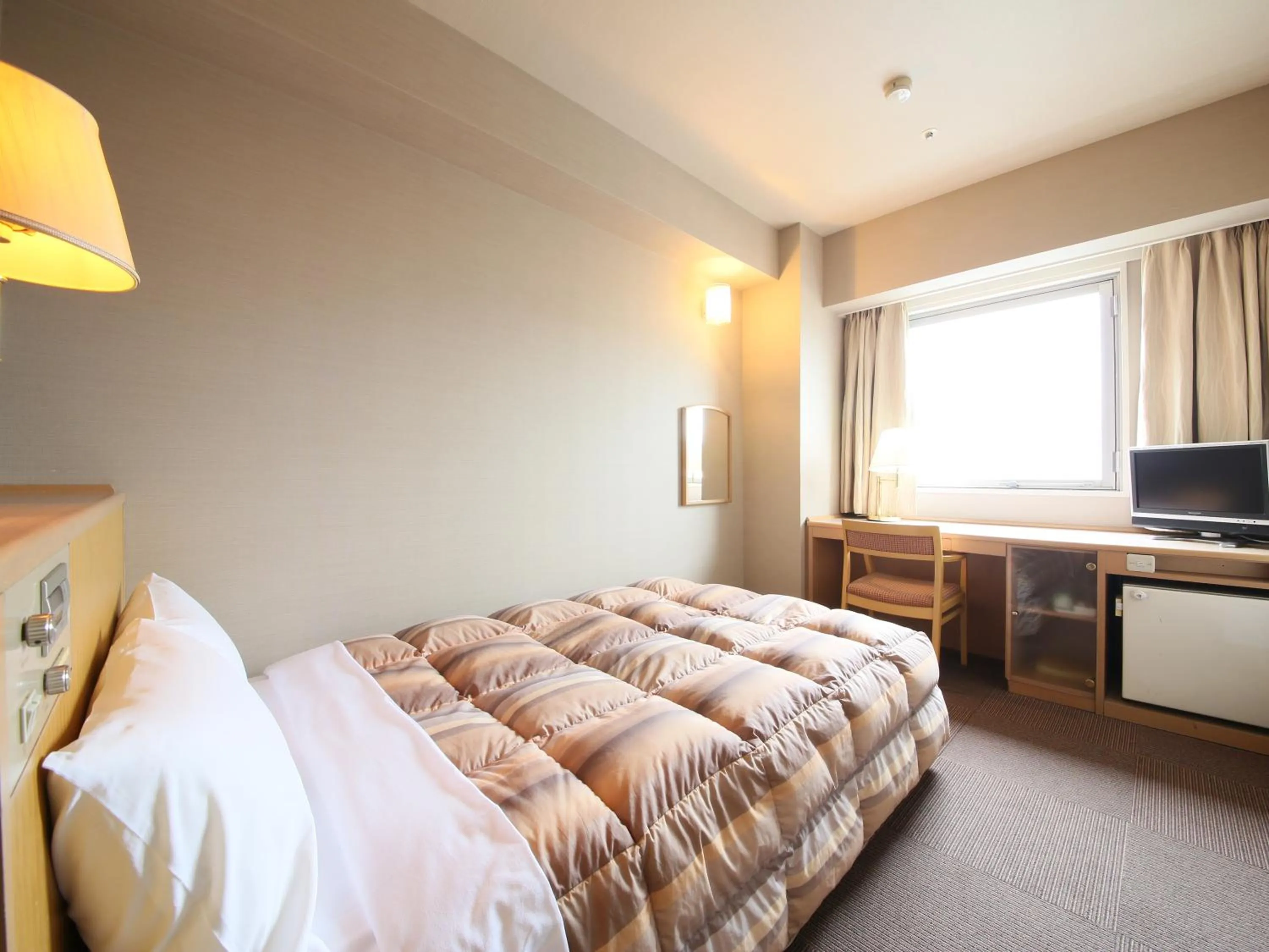 Bed in Rako Hananoi Hotel