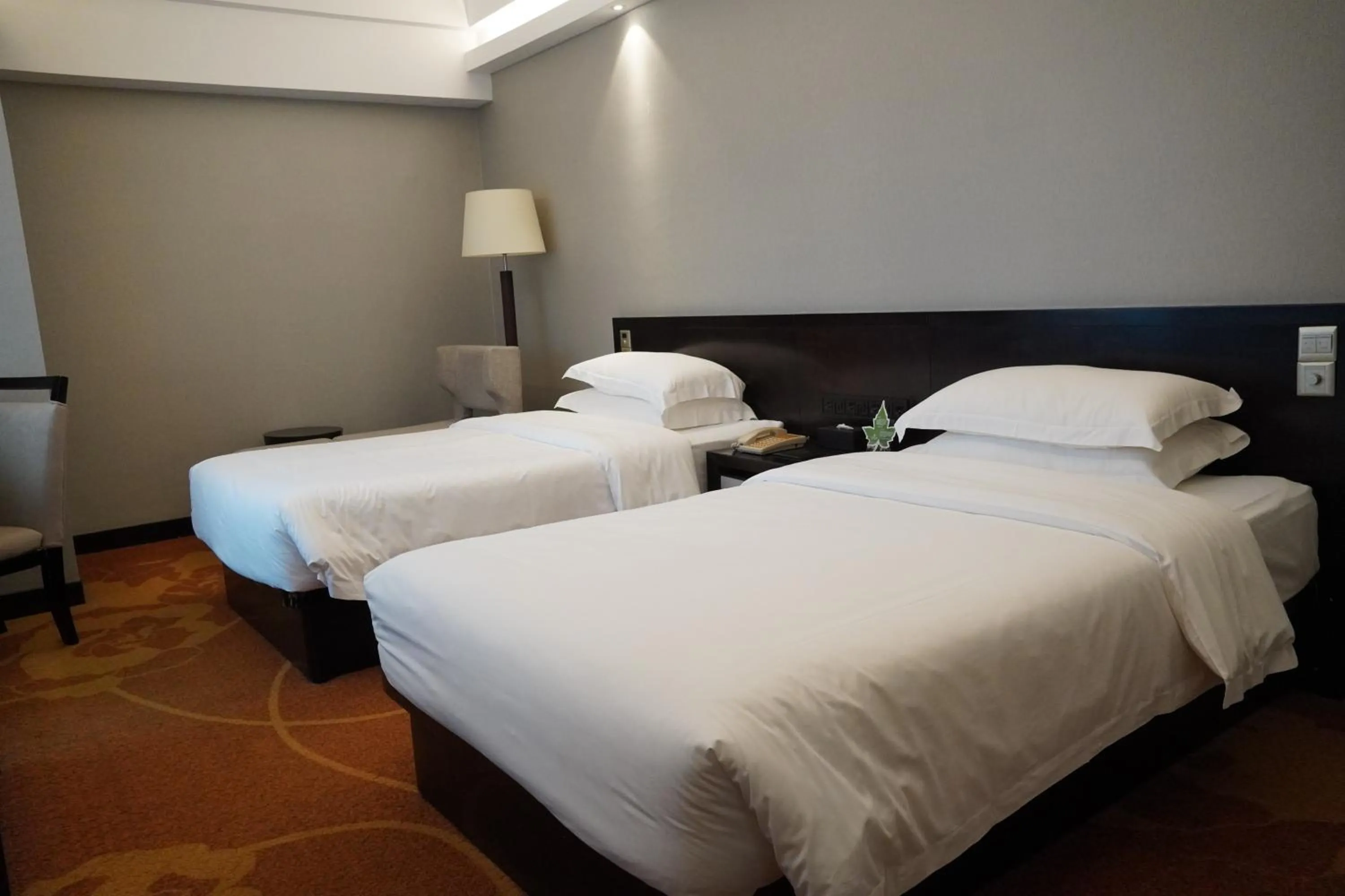 Bed in Landmark International Hotel