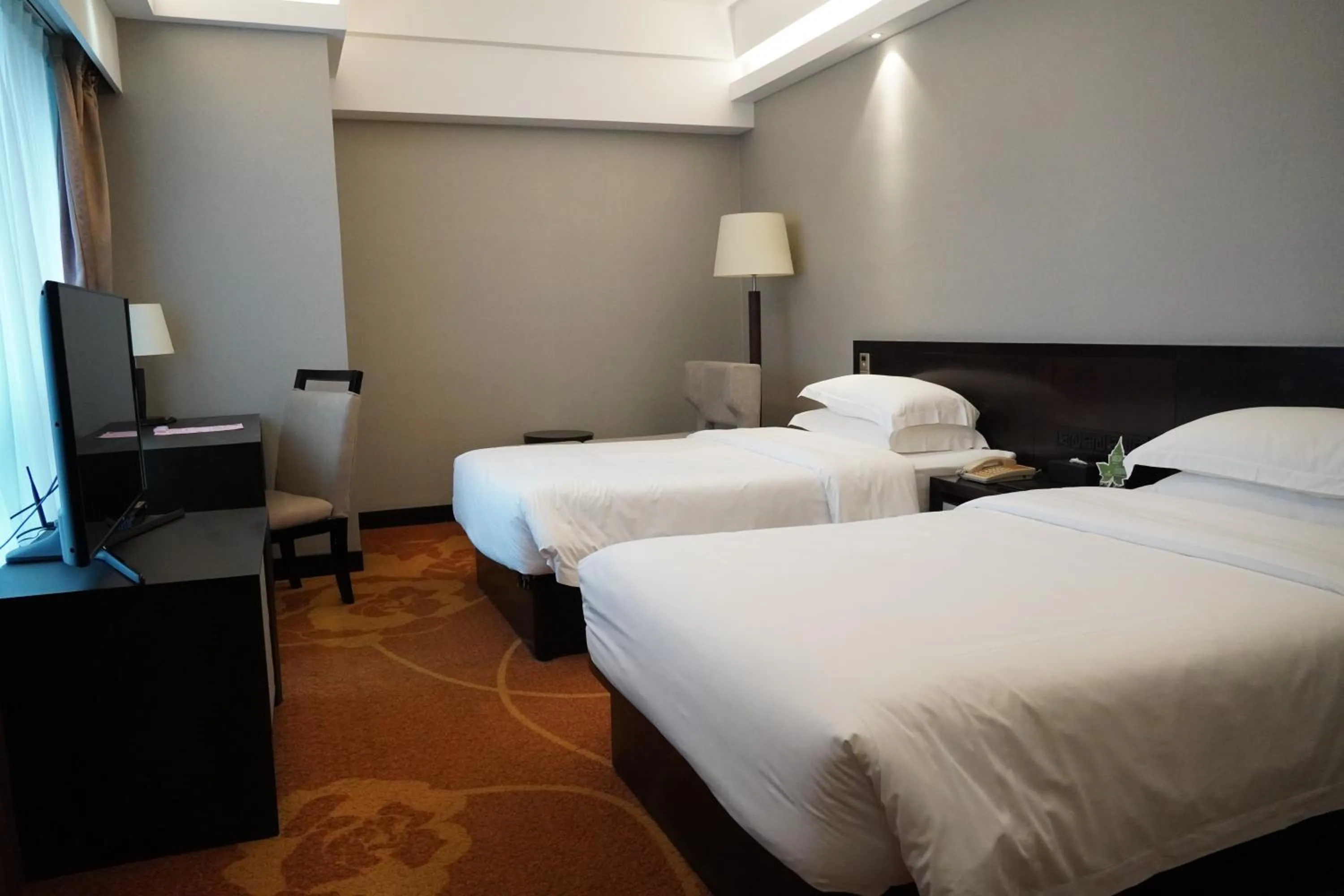 Bed in Landmark International Hotel