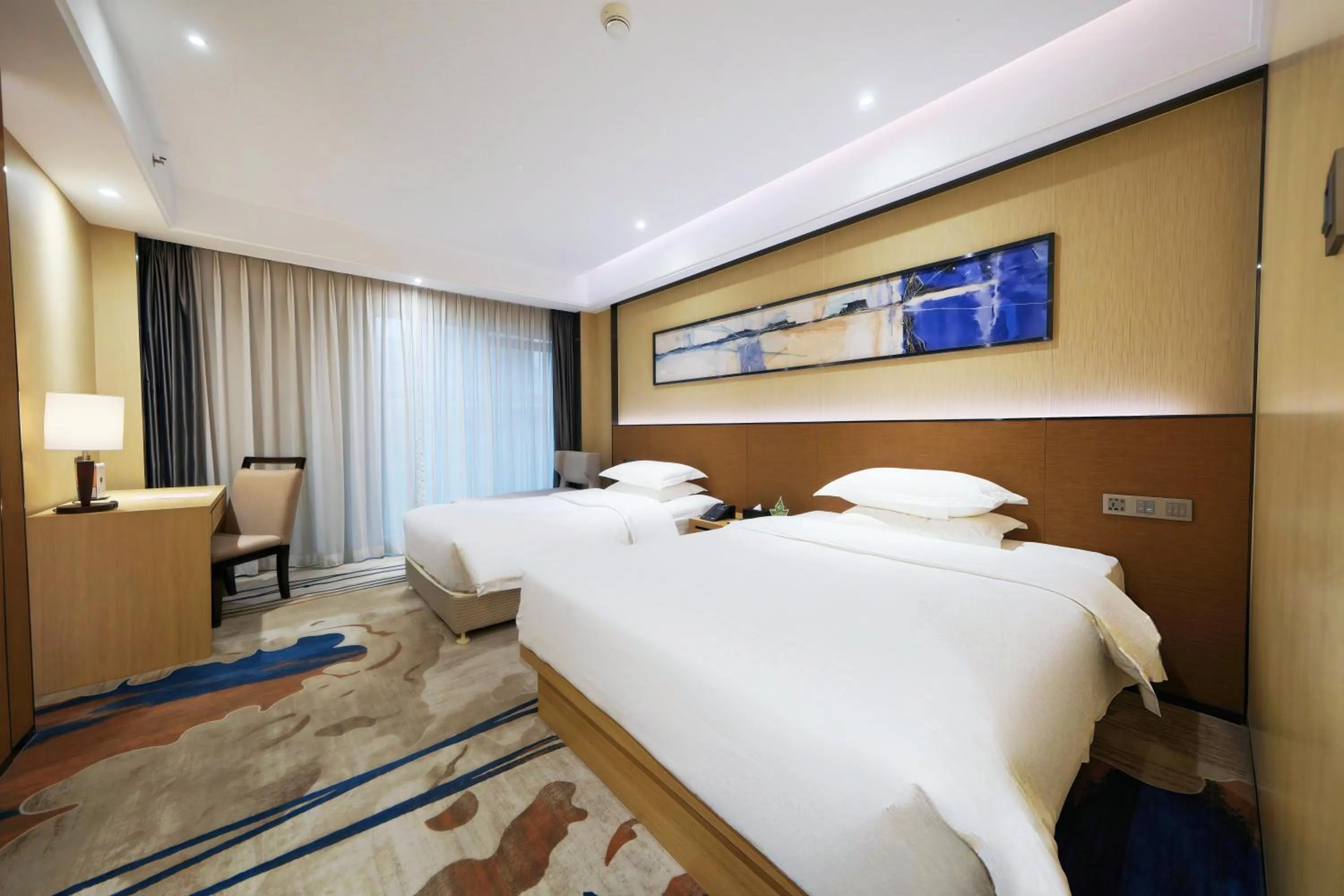 Bed in Landmark International Hotel