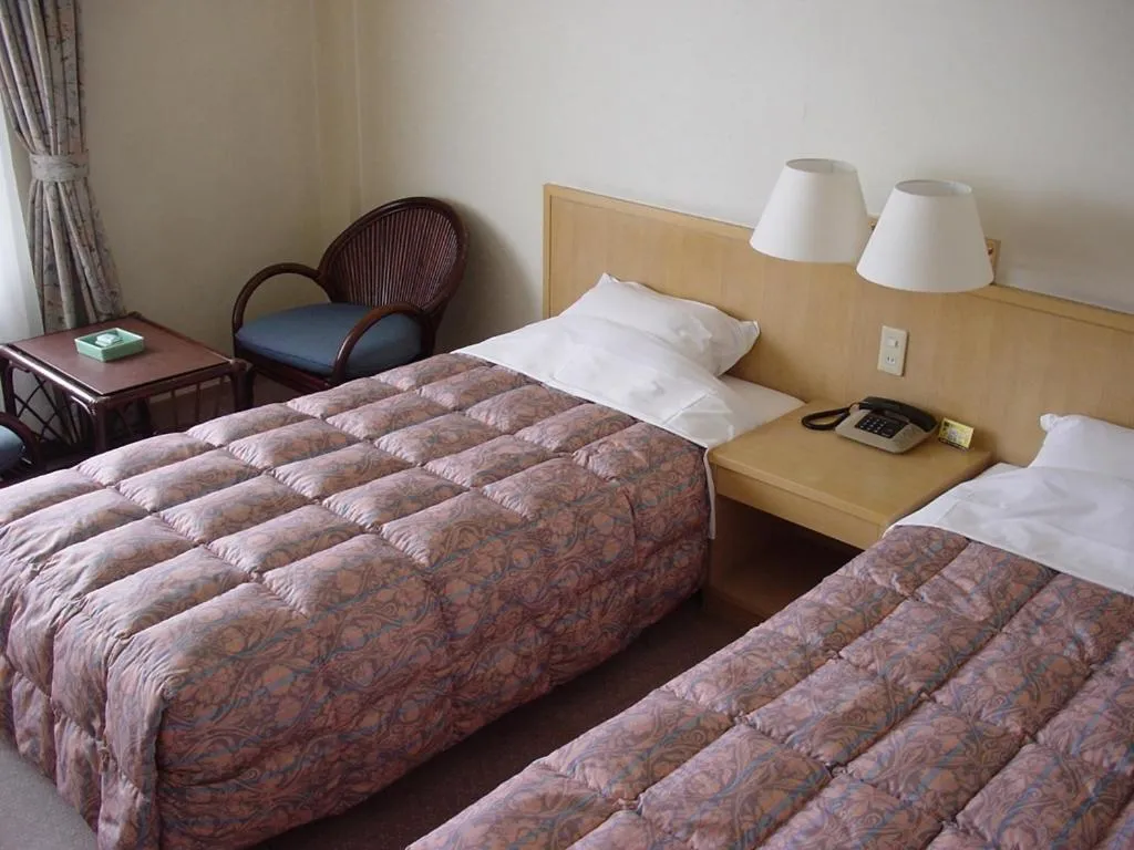 Bed in Kaike Grand Hotel Tensui