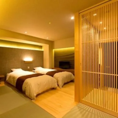 Bed in Kaike Grand Hotel Tensui