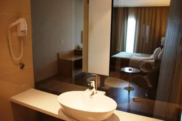 Bathroom, Bed in Boutique Hotel