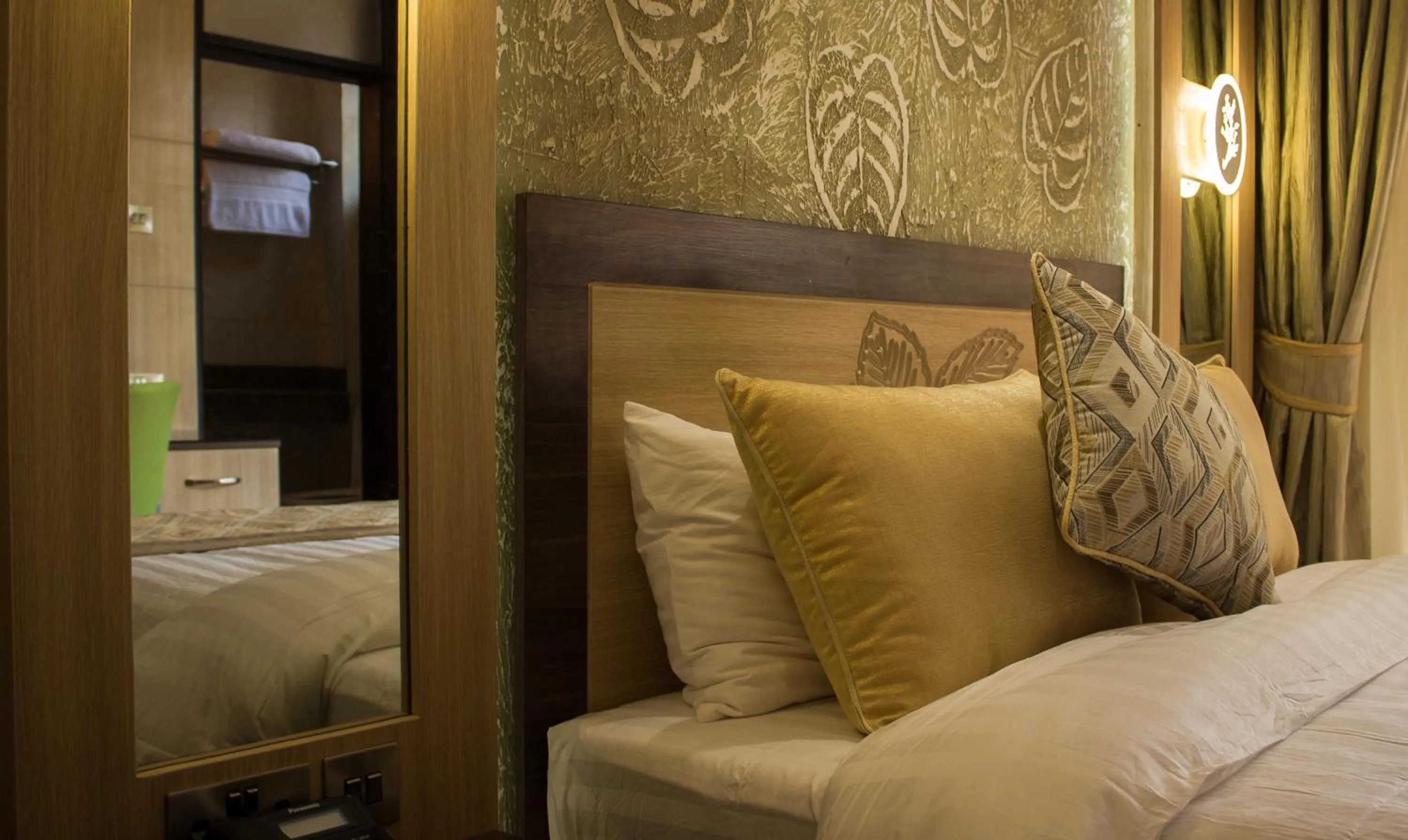 Bed in Elysian Resort