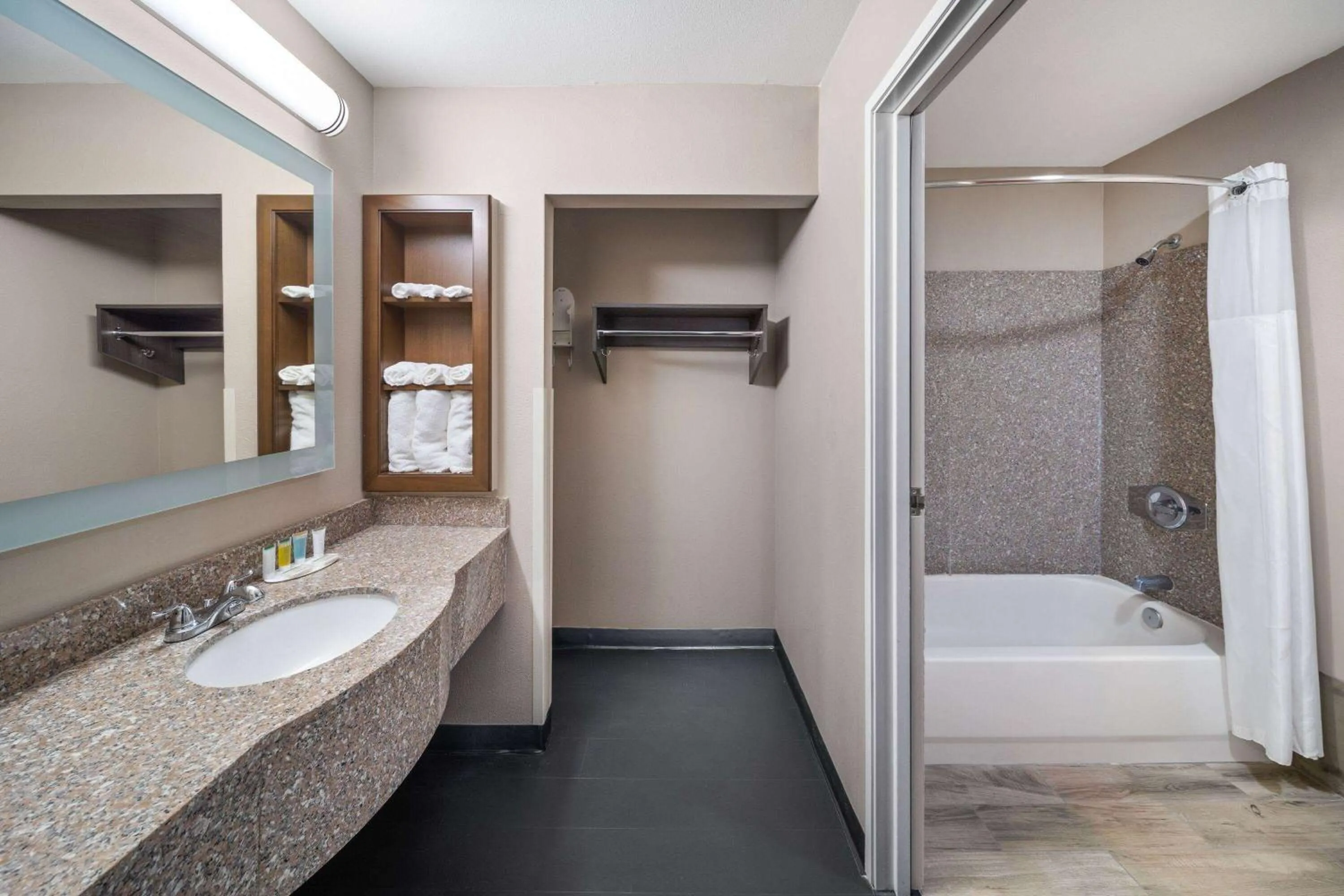 Bathroom in Super 8 by Wyndham Lubbock West