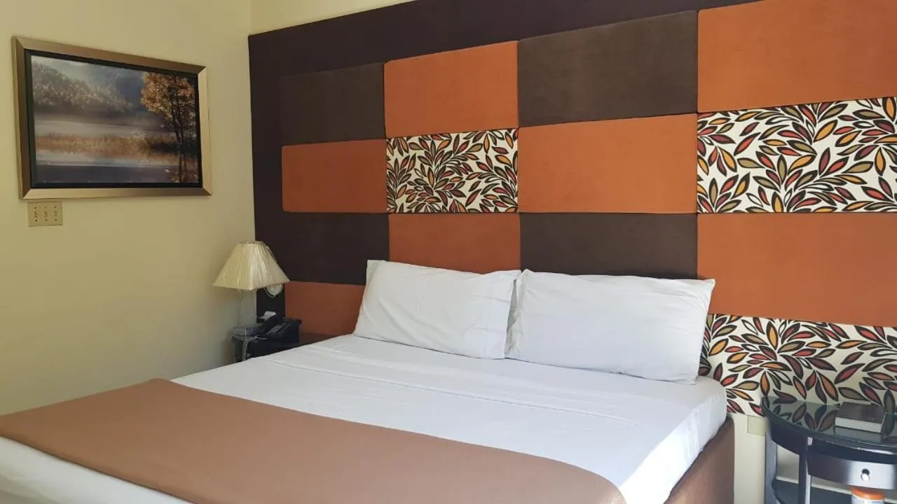 Bed in Christar Villas Hotel