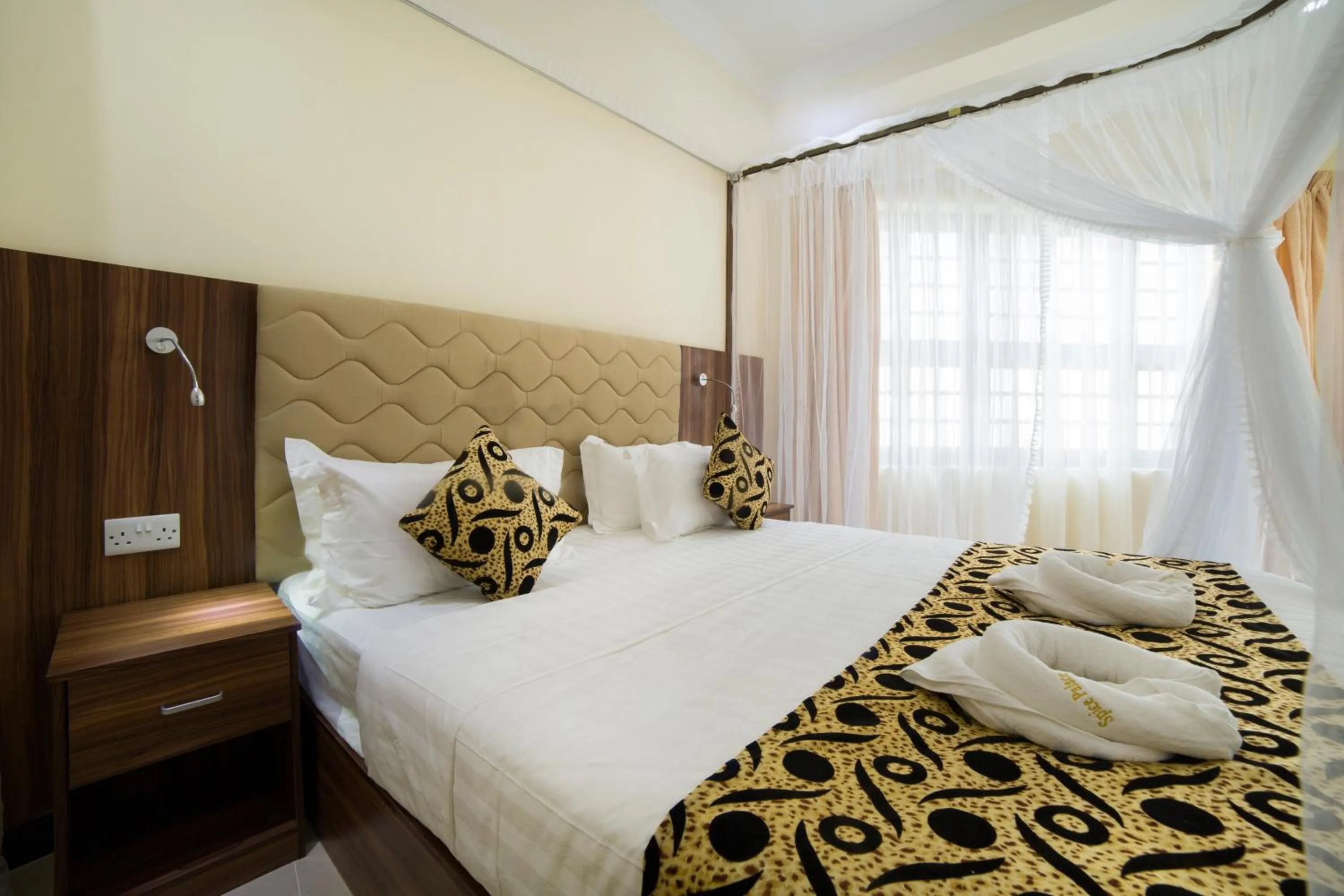 Bed in Spice Palace Hotel