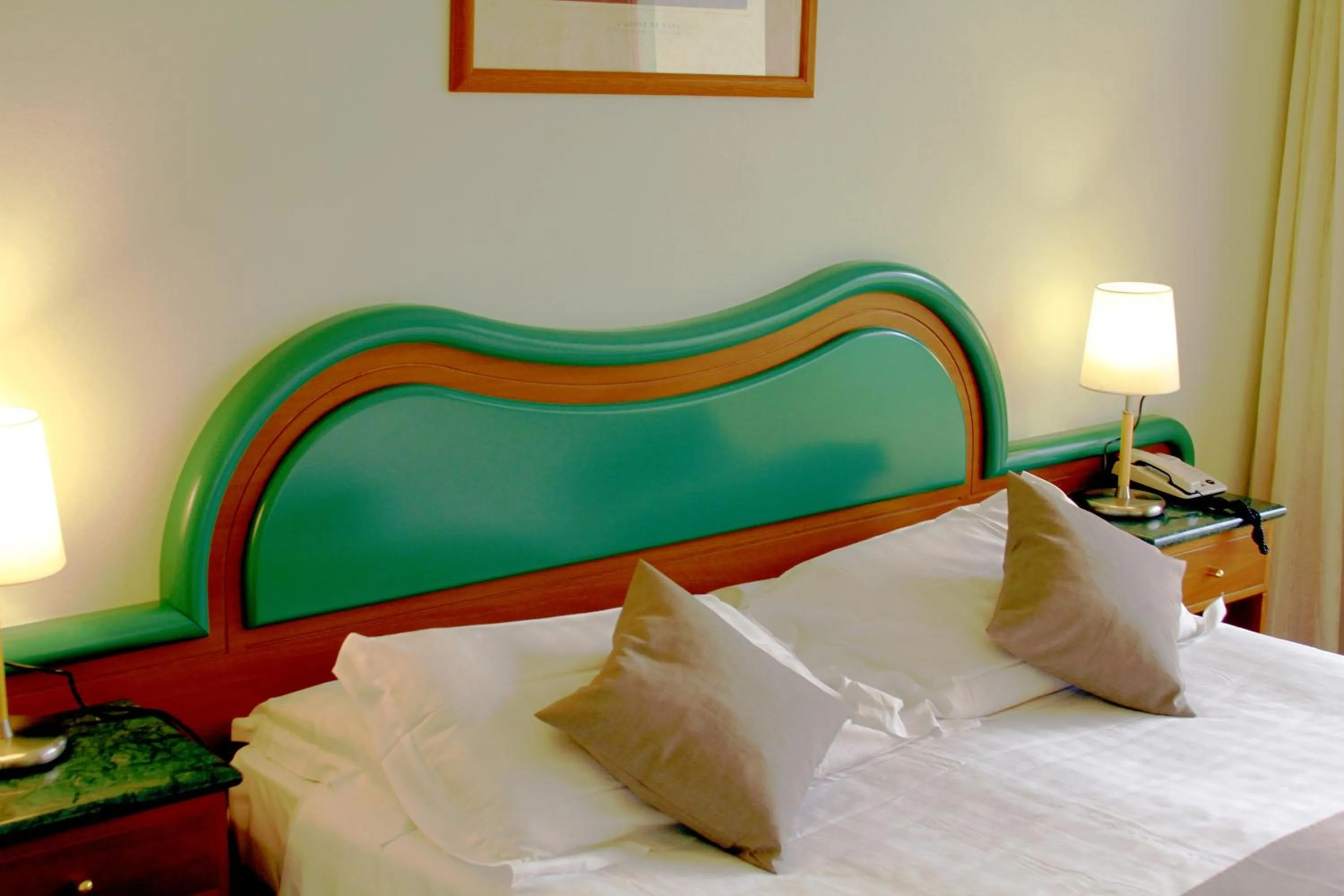 Bed in La Fonte Hotel