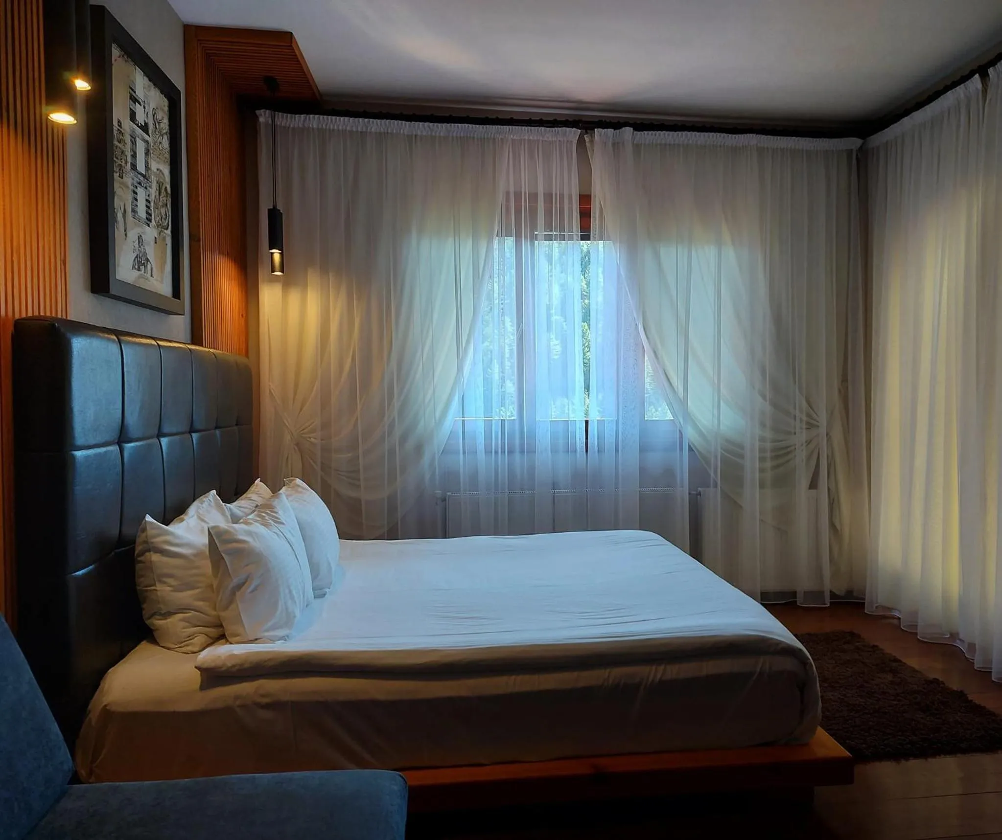 Bed in Aurora Resort & Spa