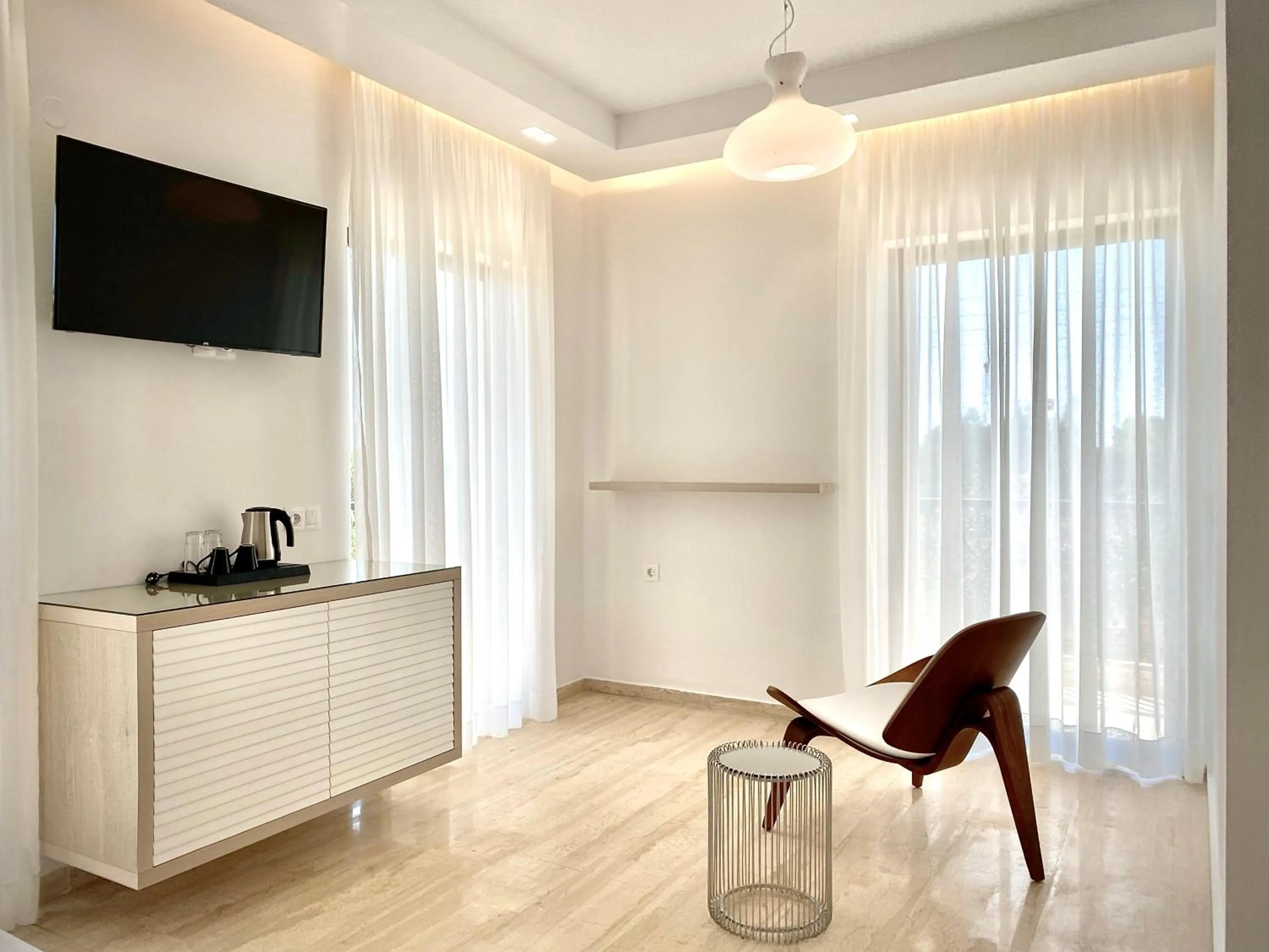 Seating area in IONIAN SUITES by Bruskos