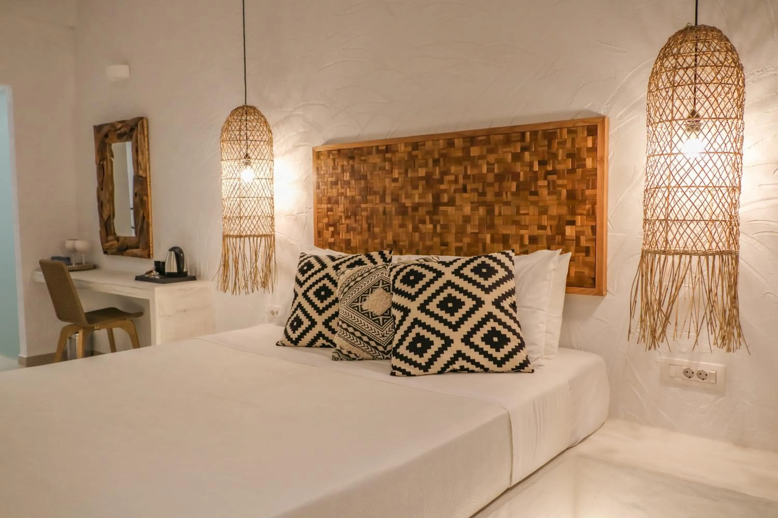 Bed in Delfini Beach Hotel & Suites