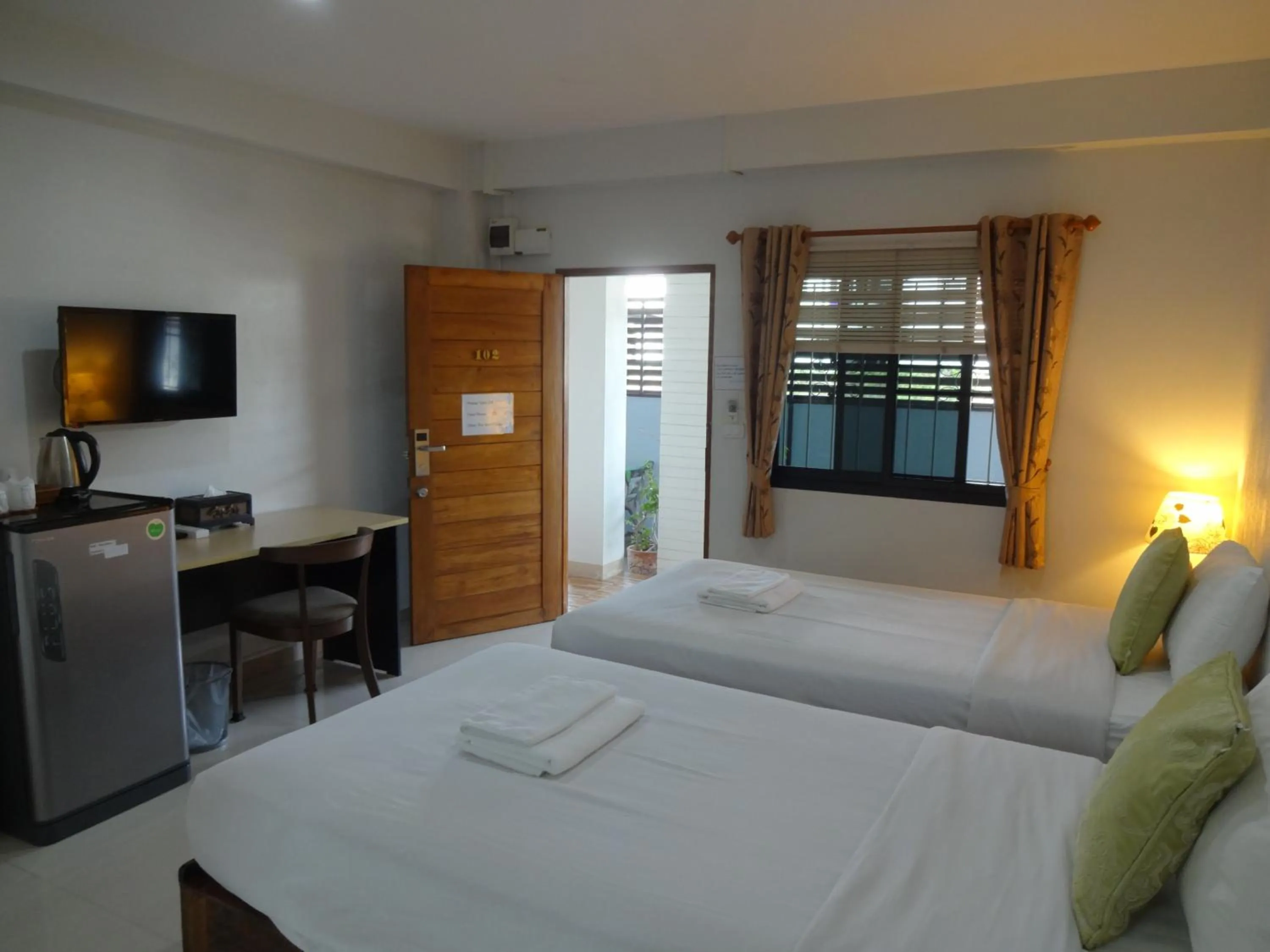 Photo of the whole room, Bed in Rena House Chiang Mai