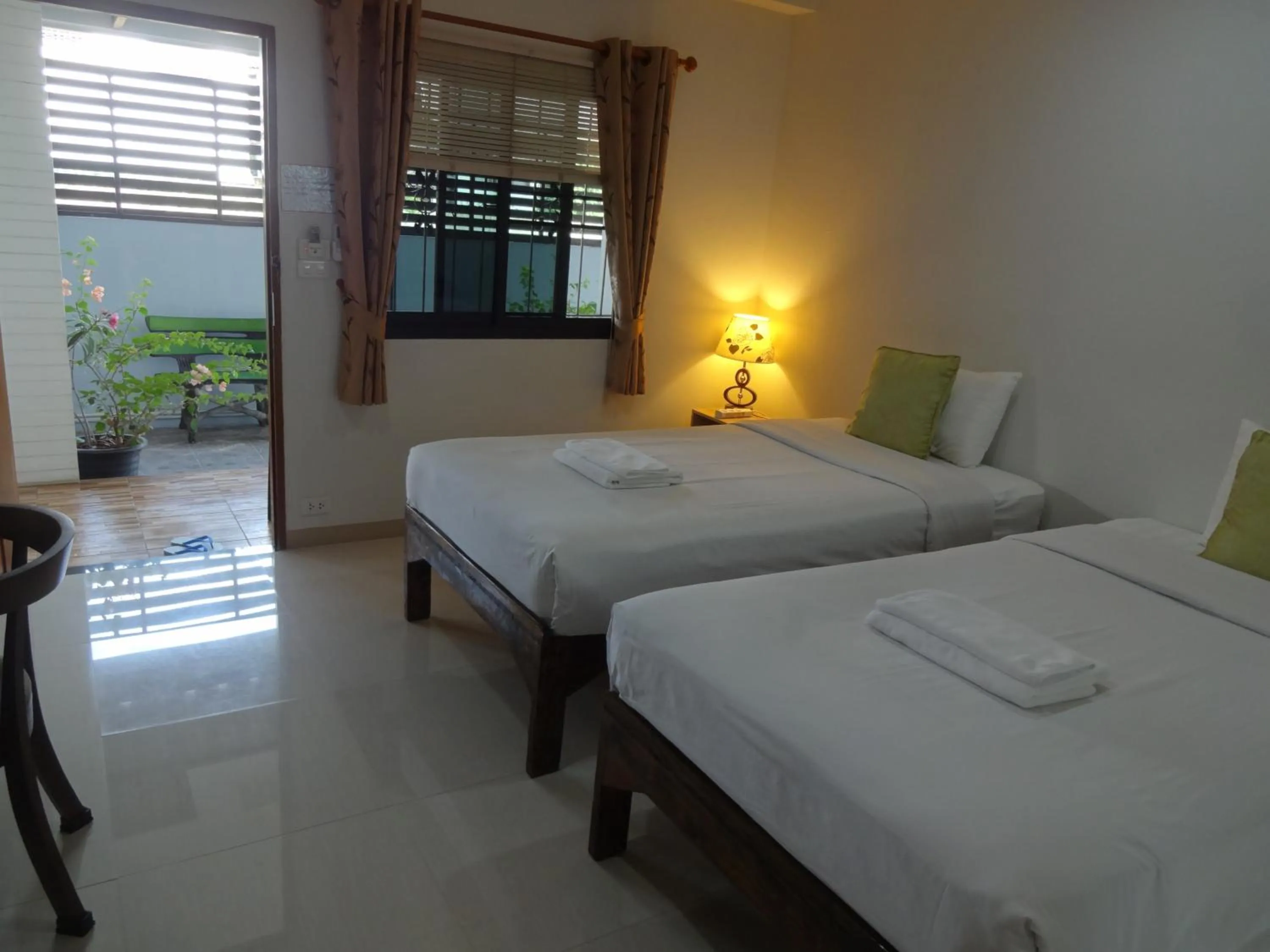 Photo of the whole room, Bed in Rena House Chiang Mai