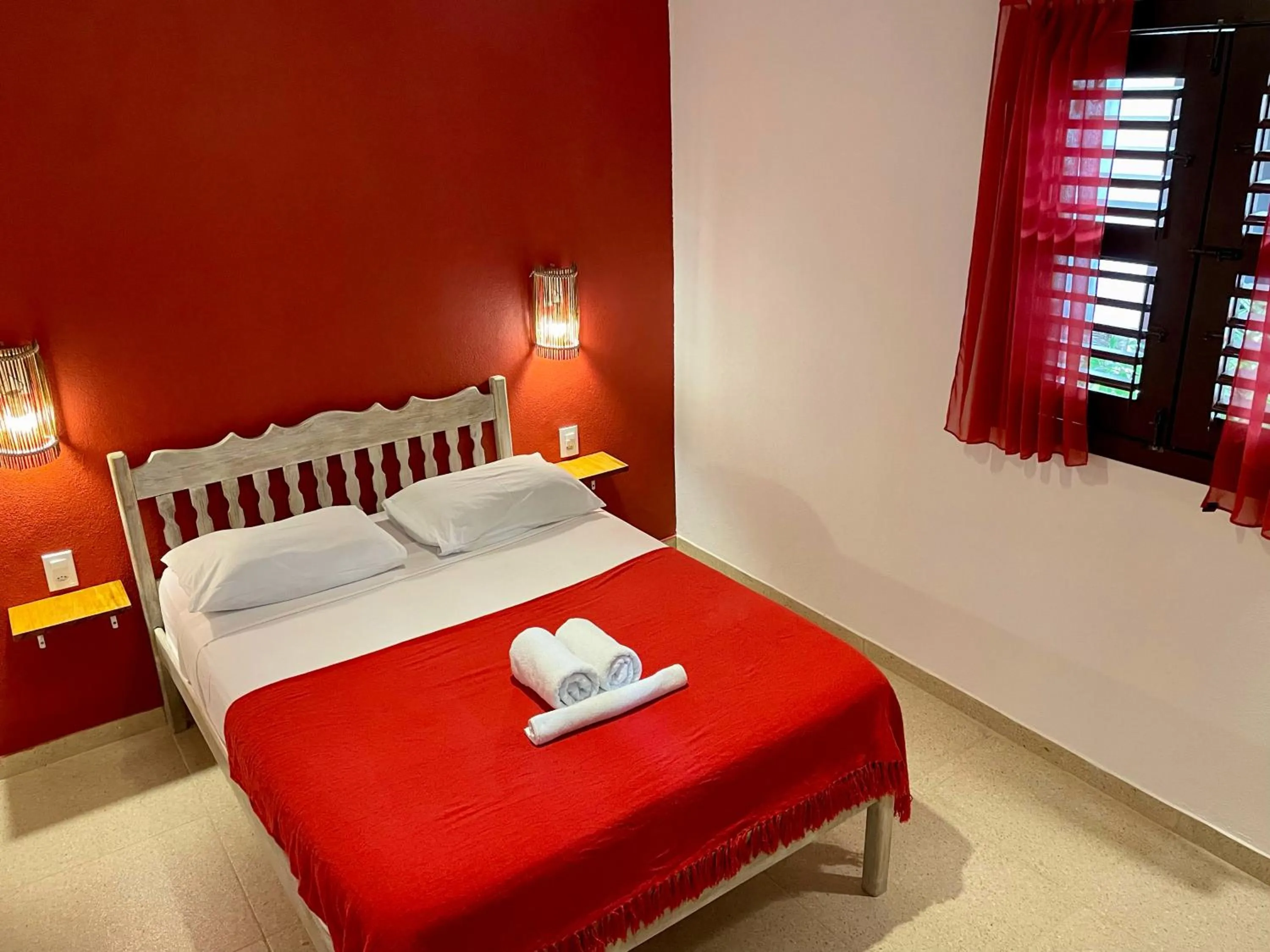 Bed in Pousada Atlantis