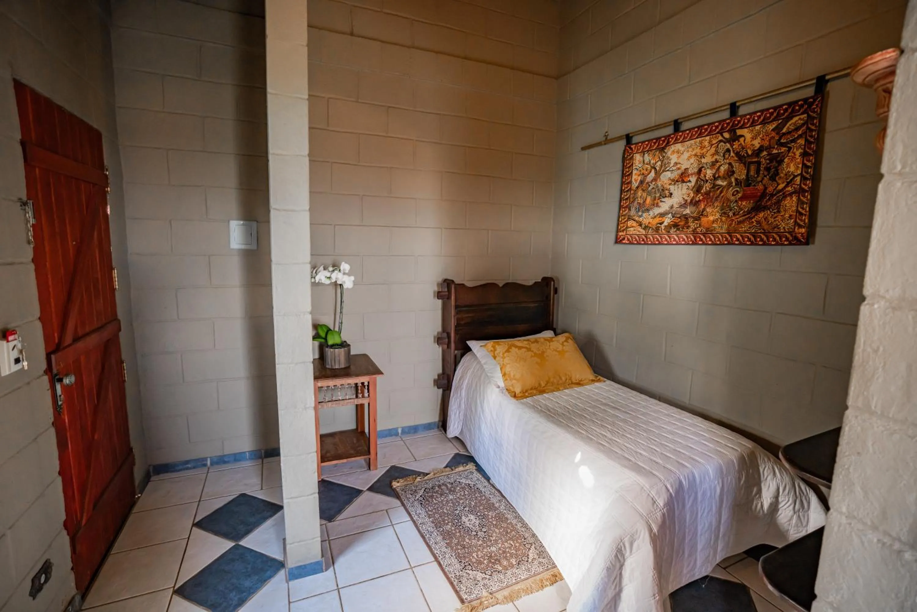 Bedroom, Bed in Pousada Camelot Inn