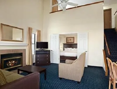 Living room, Bed in Hawthorn Extended Stay by Wyndham Fort Wayne