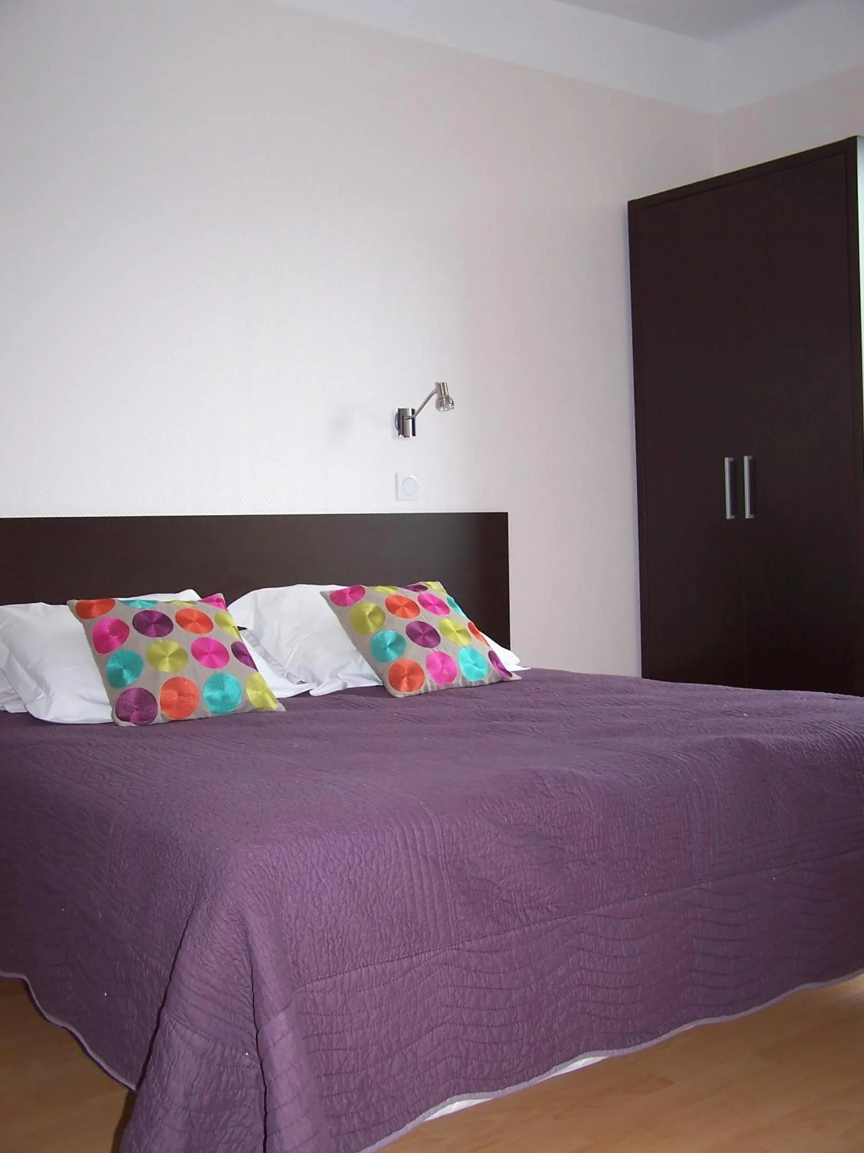 Bed in Logis Hôtel Le Jabron