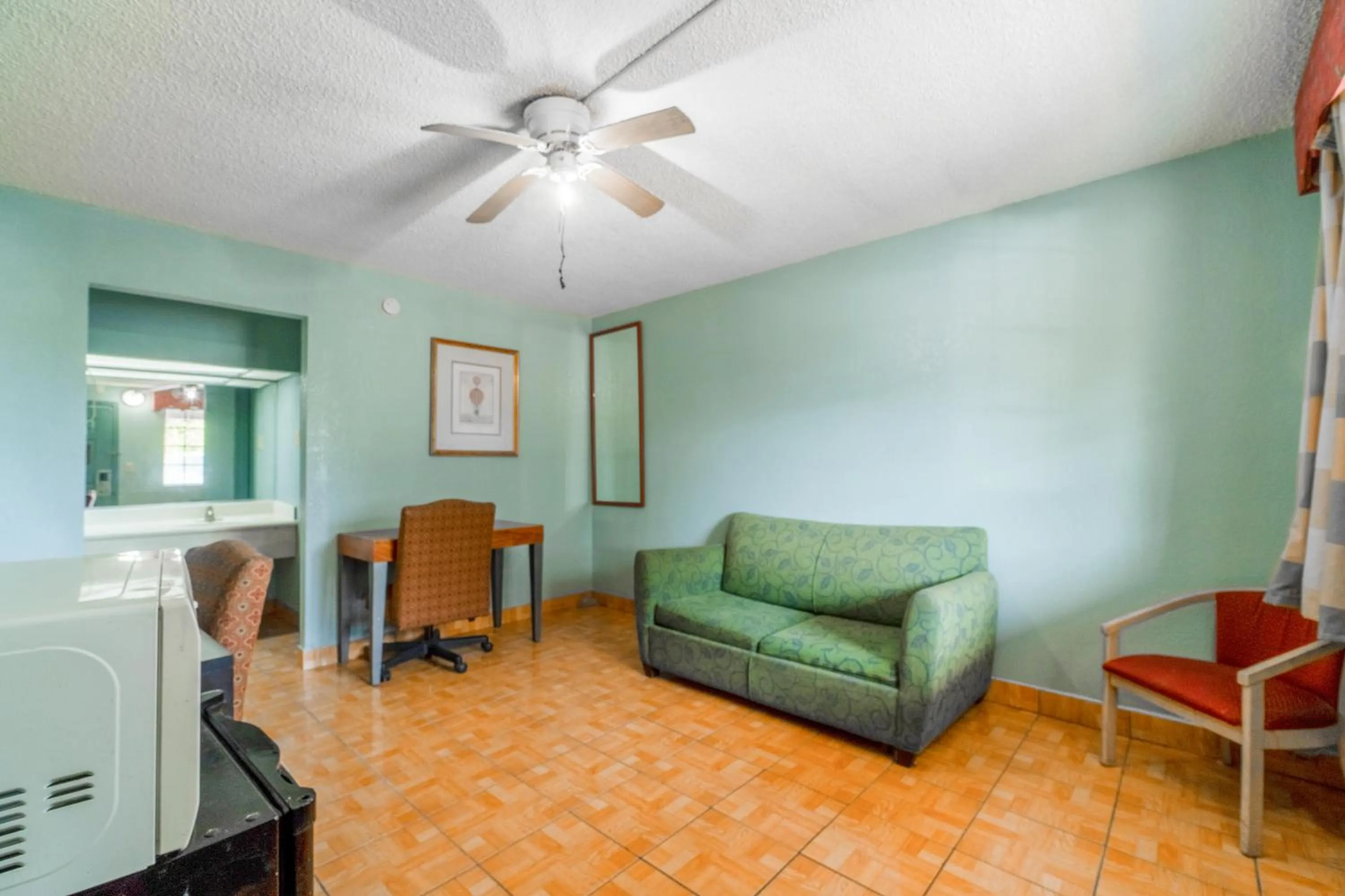 Seating area in Lone Star Inn & Suites by OYO Harlingen TX