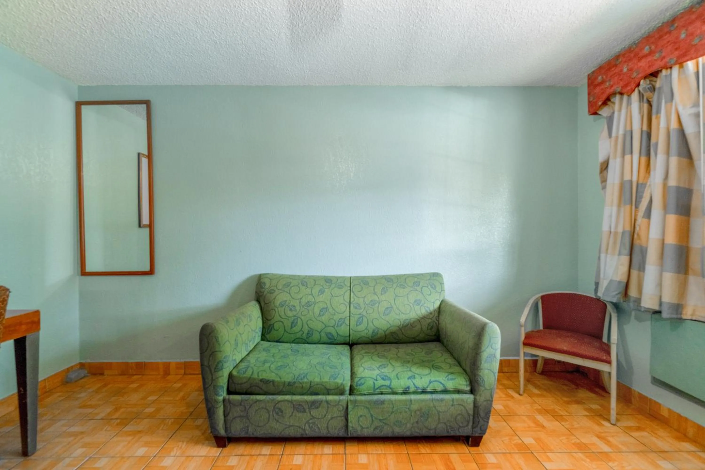 Seating area in Lone Star Inn & Suites by OYO Harlingen TX