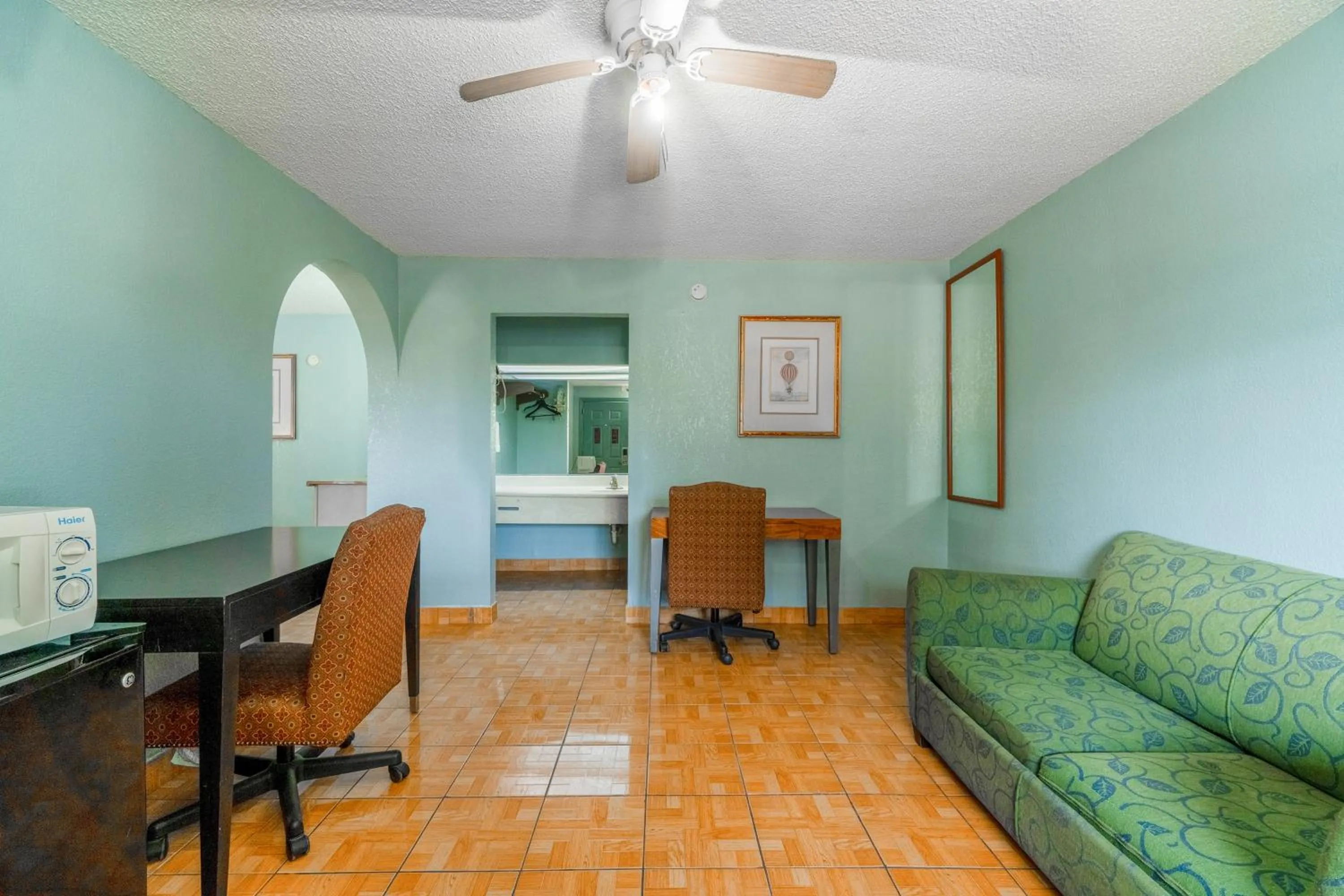 Seating area in Lone Star Inn & Suites by OYO Harlingen TX