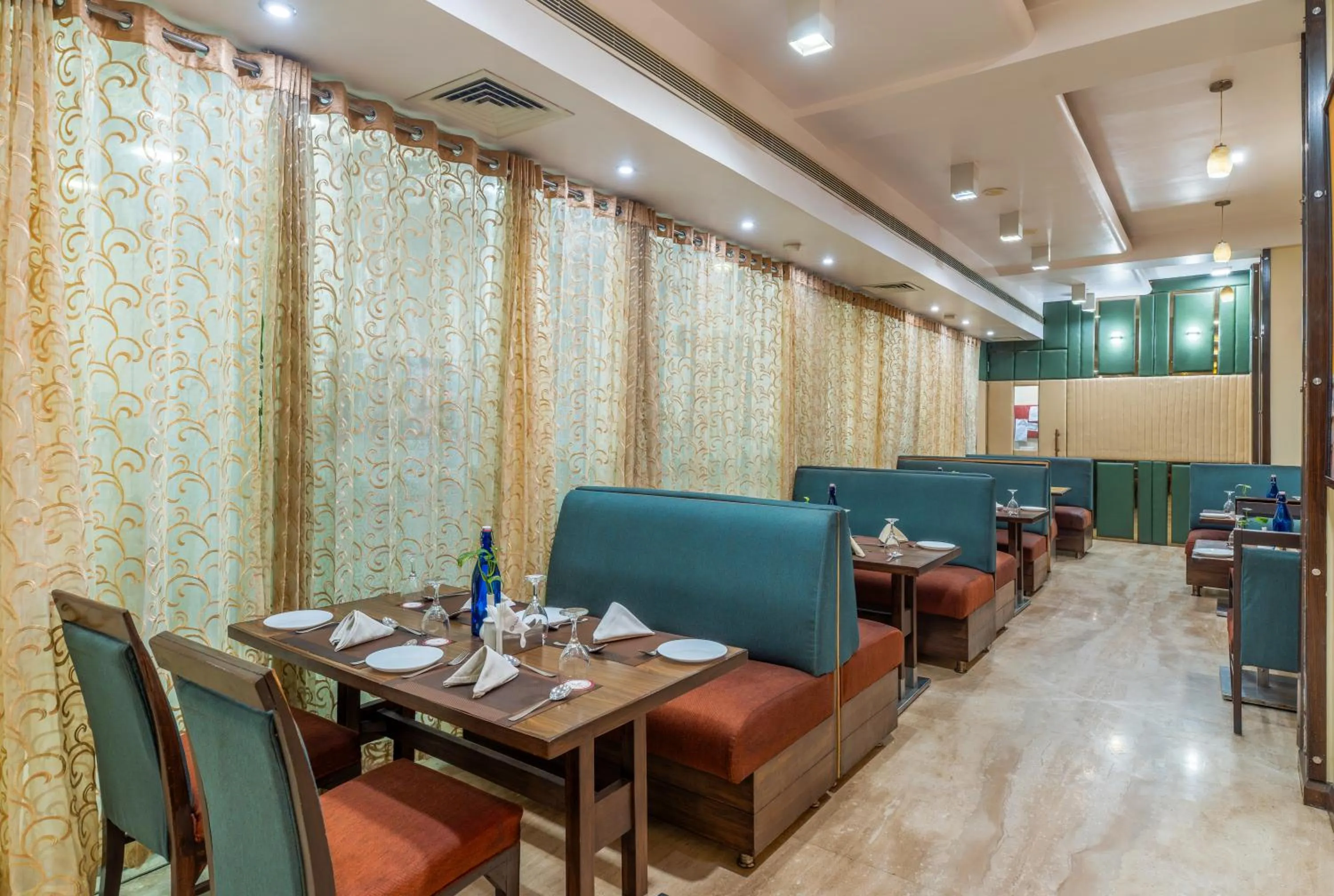 Dining area in Amantra Comfort Hotel