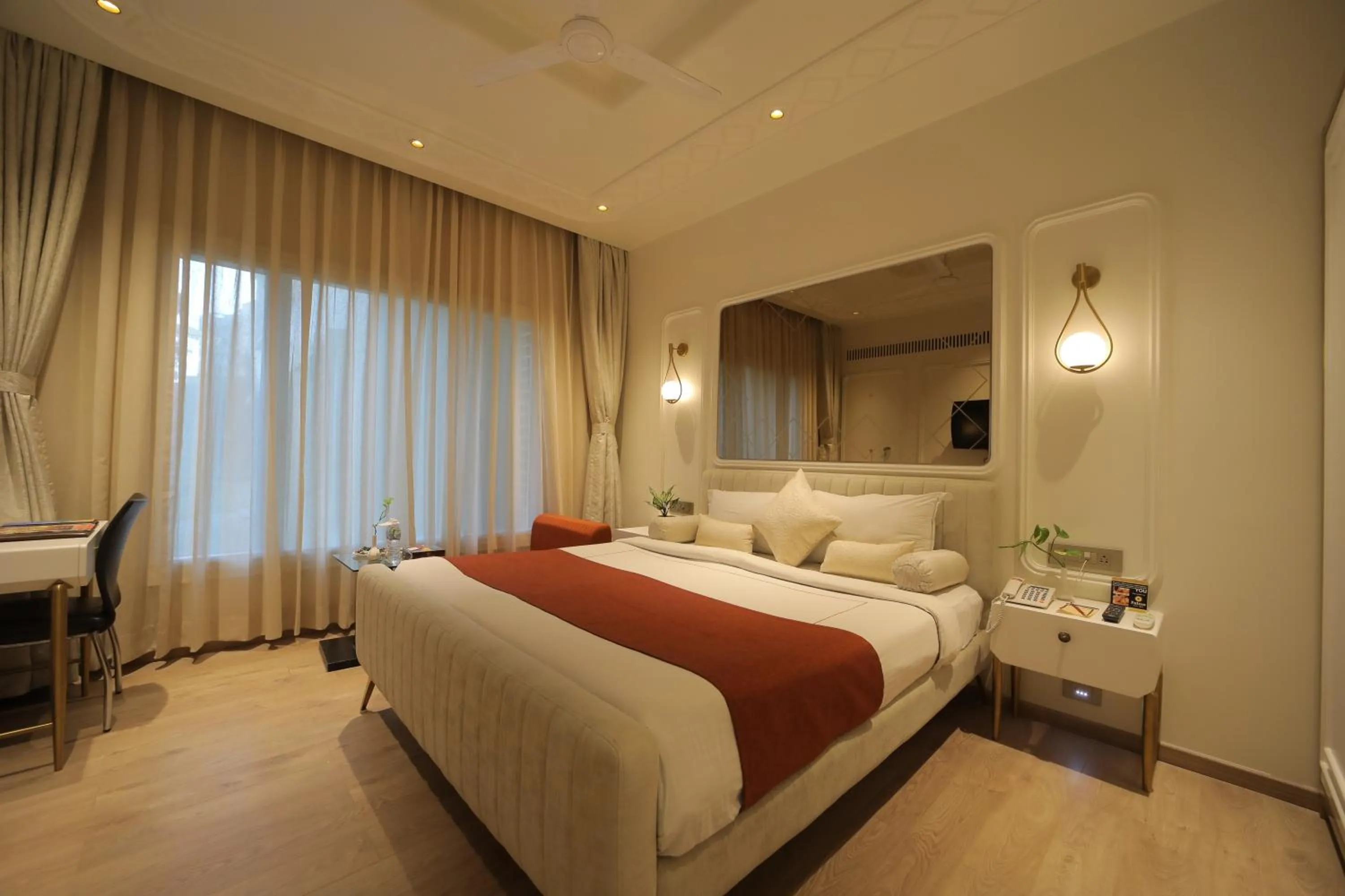 Bed in Amantra Comfort Hotel