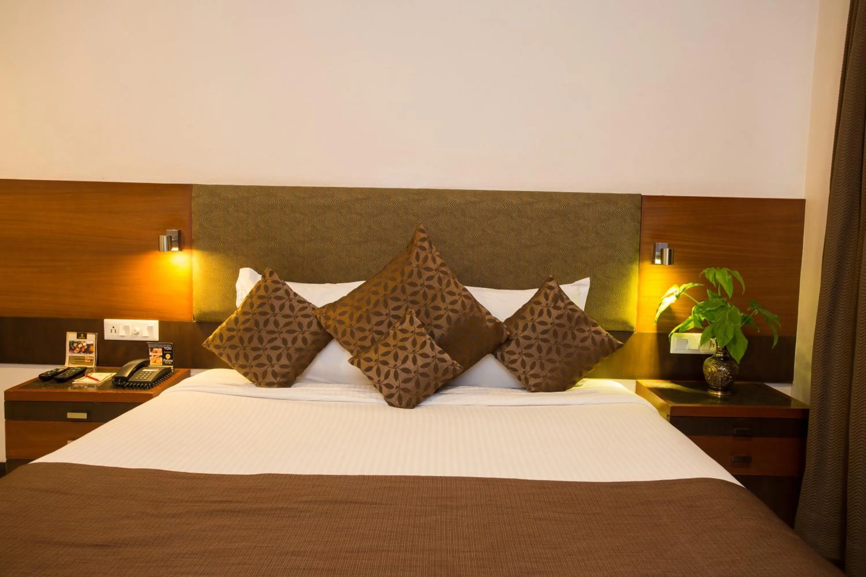 Bed in Amantra Comfort Hotel