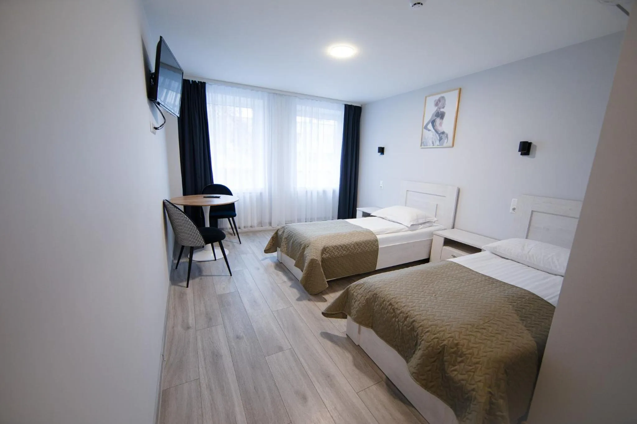 Bed in Dzukija Hotel