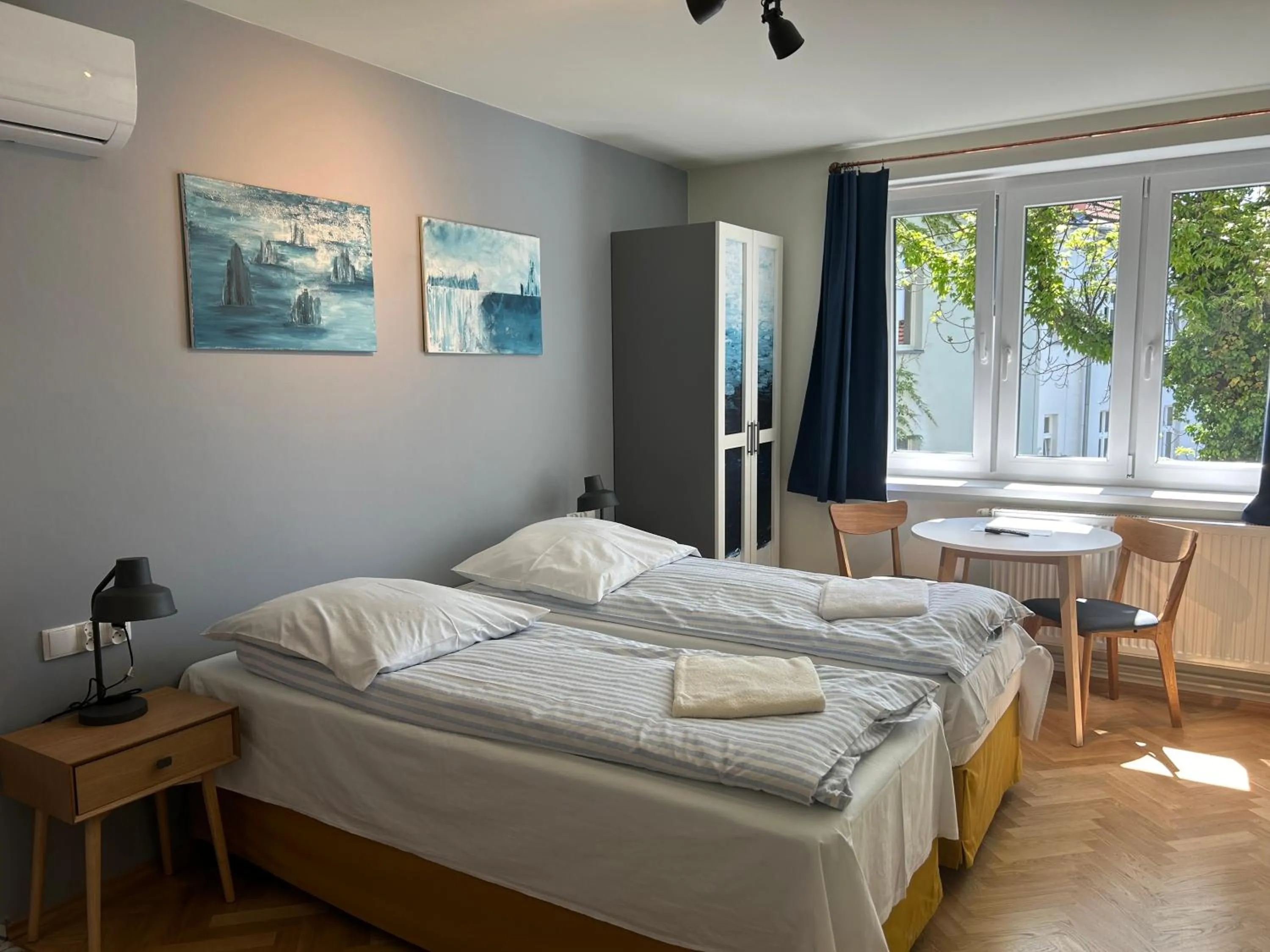 Bed in Cybulskiego Guest Rooms