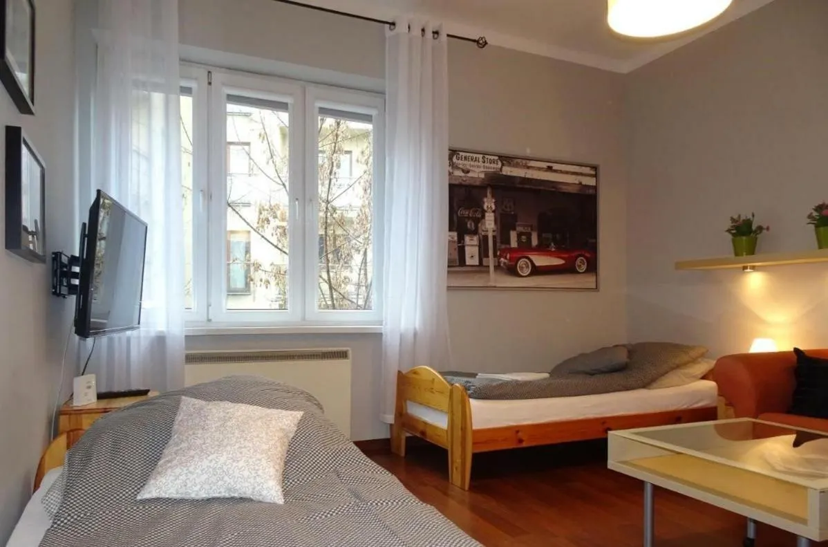 Bed in Cybulskiego Guest Rooms