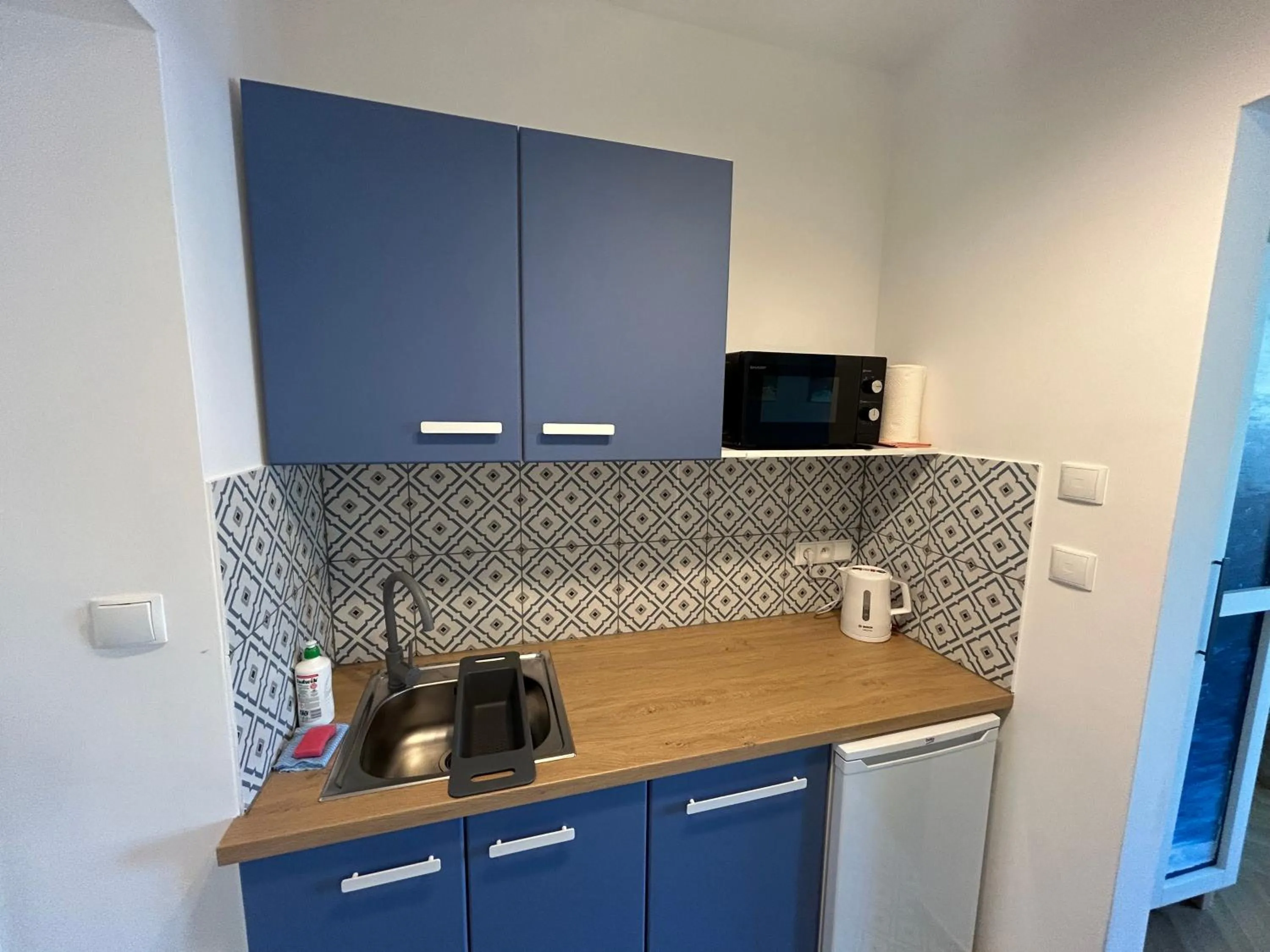 Kitchen or kitchenette in Cybulskiego Guest Rooms