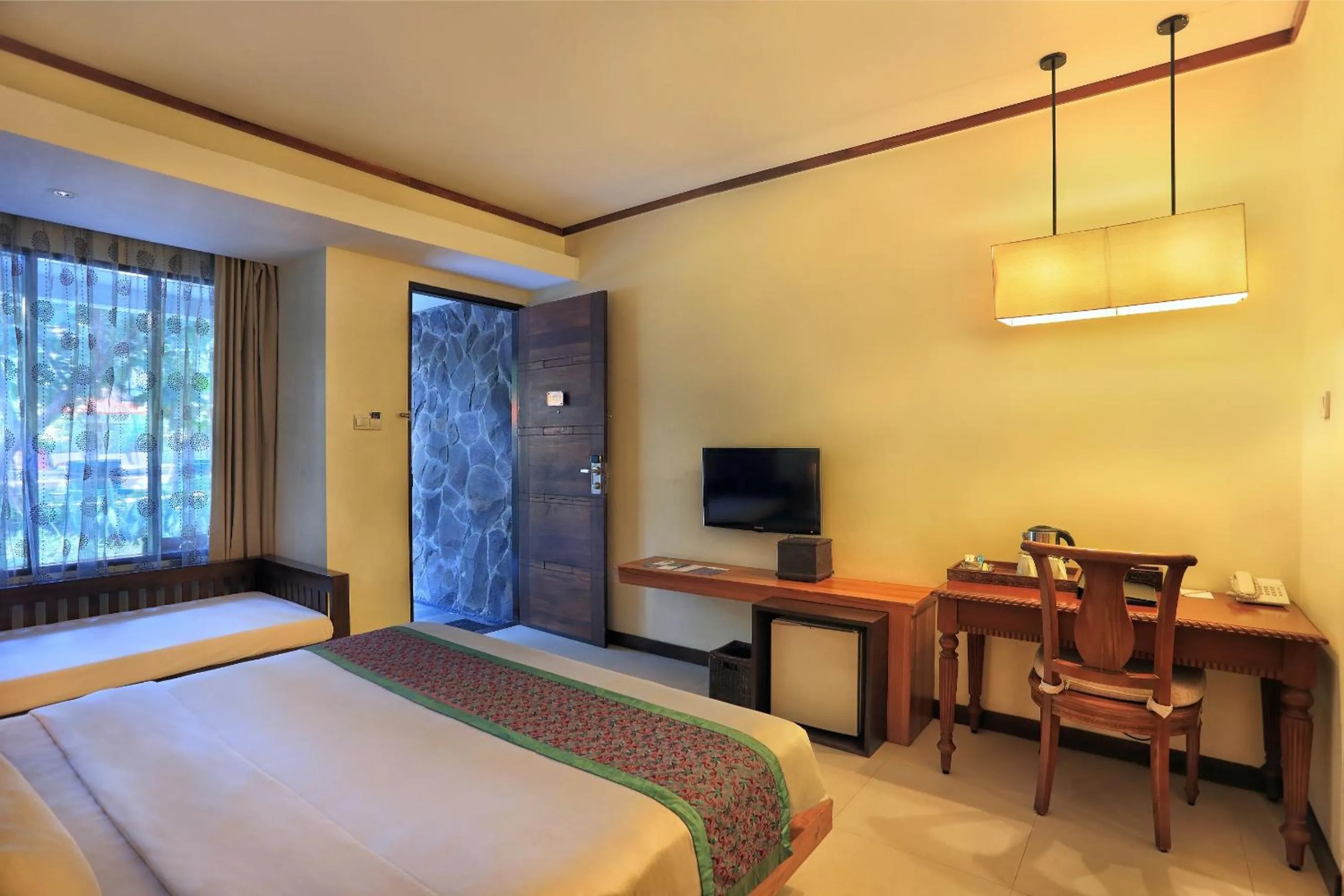 Bedroom, Bed in Aston Sunset Beach Resort - Gili Trawangan