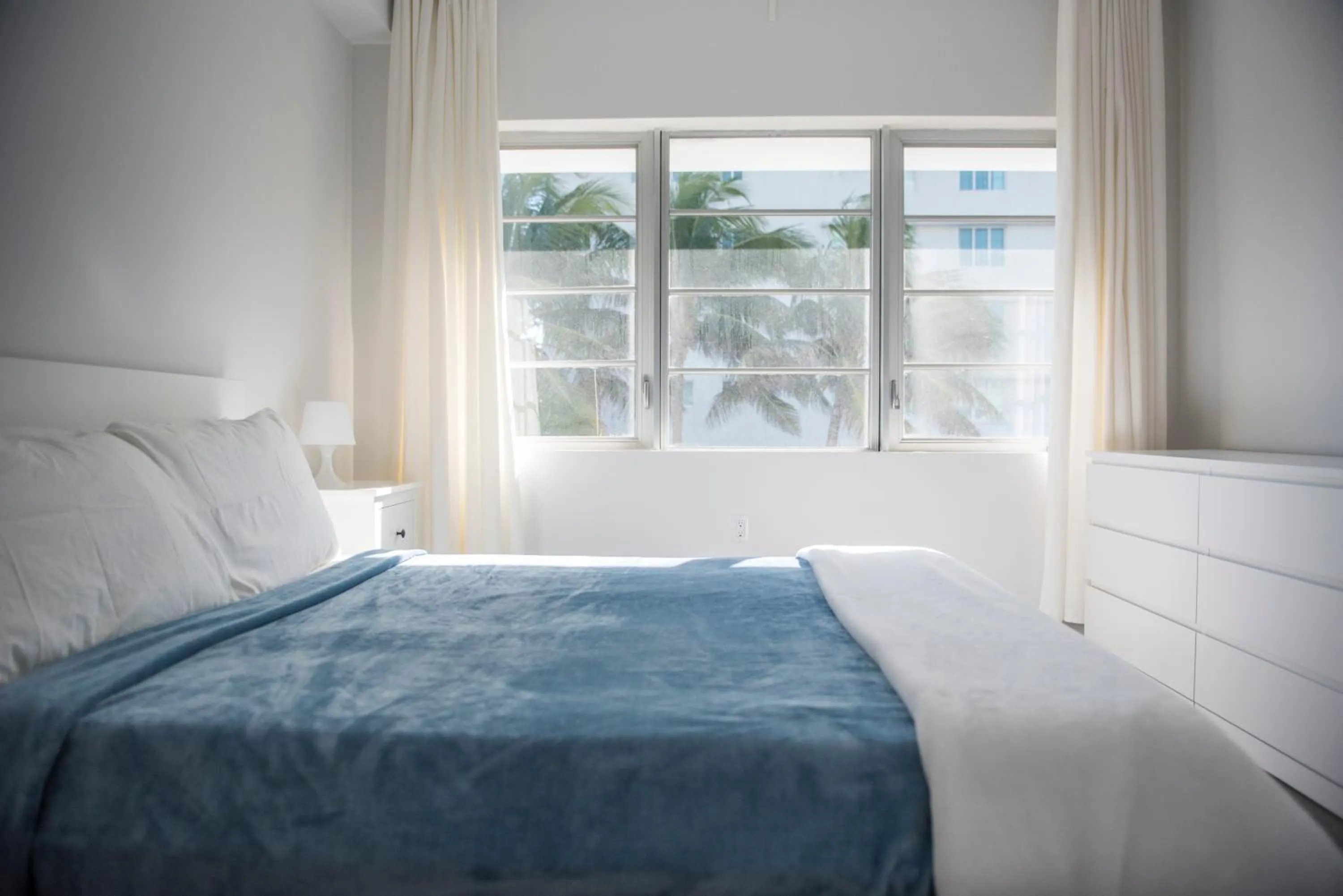 Bed in 12th & Ocean Suites by LuxUrban