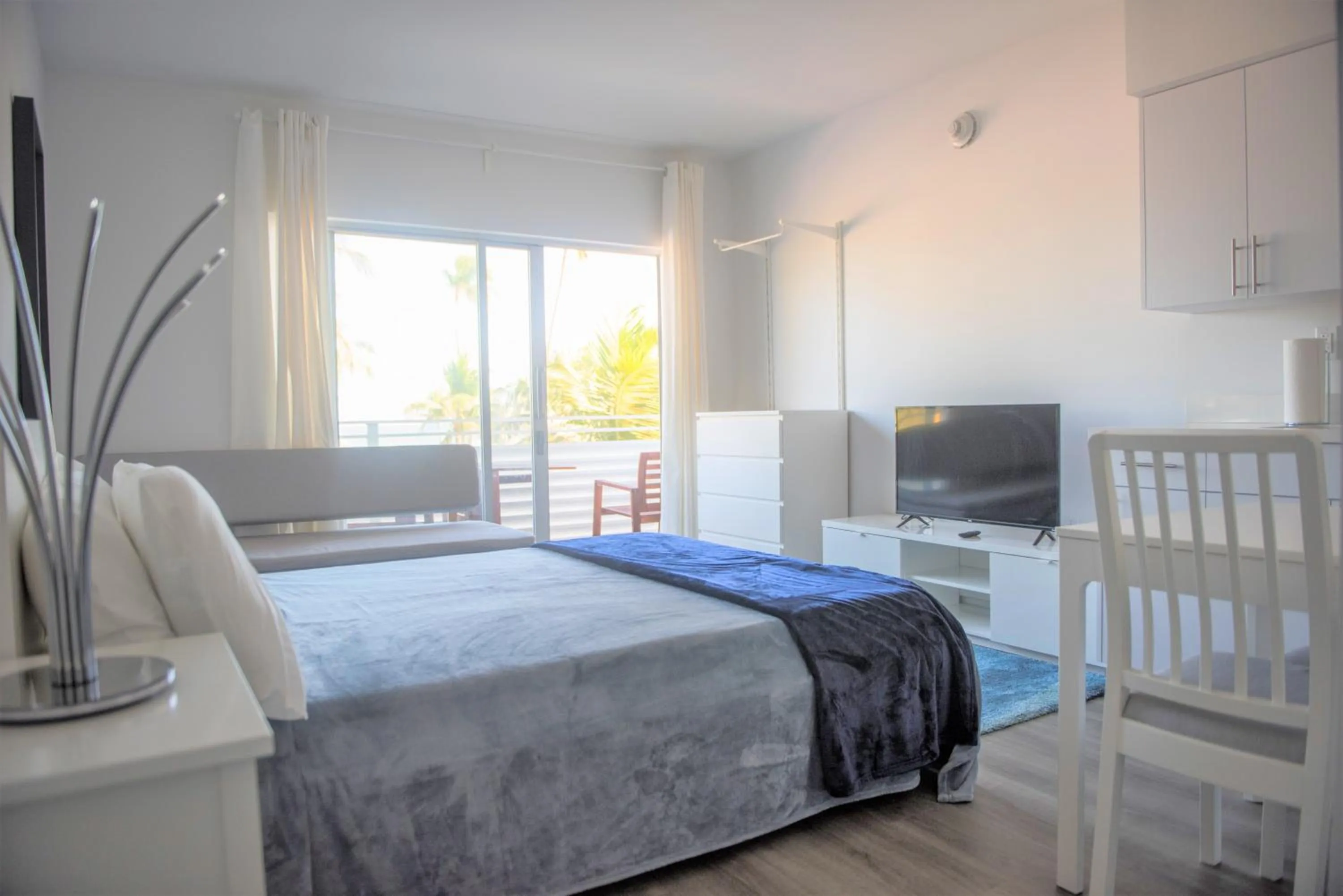 Bed in 12th & Ocean Suites by LuxUrban