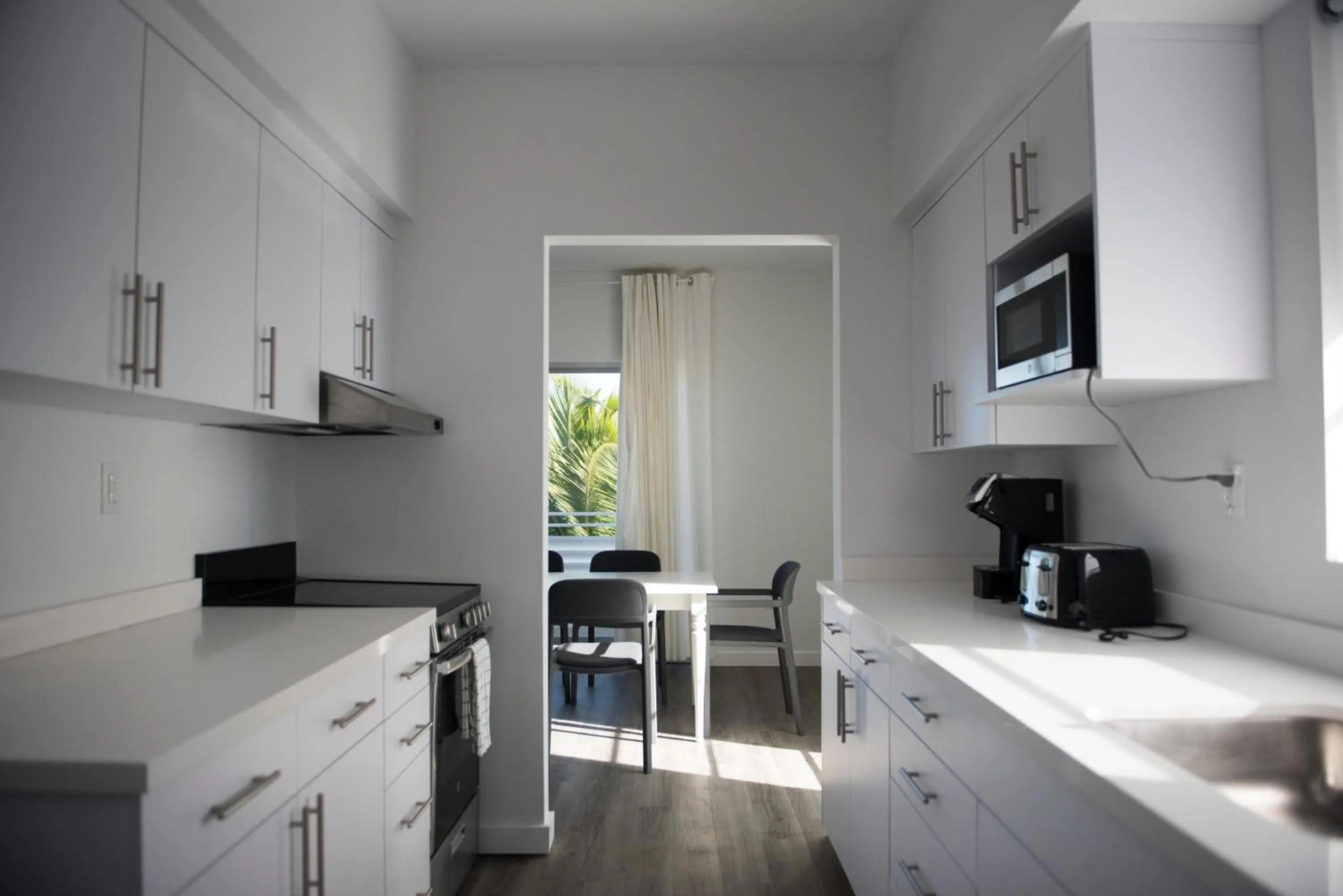 Kitchen/Kitchenette in 12th & Ocean Suites by LuxUrban