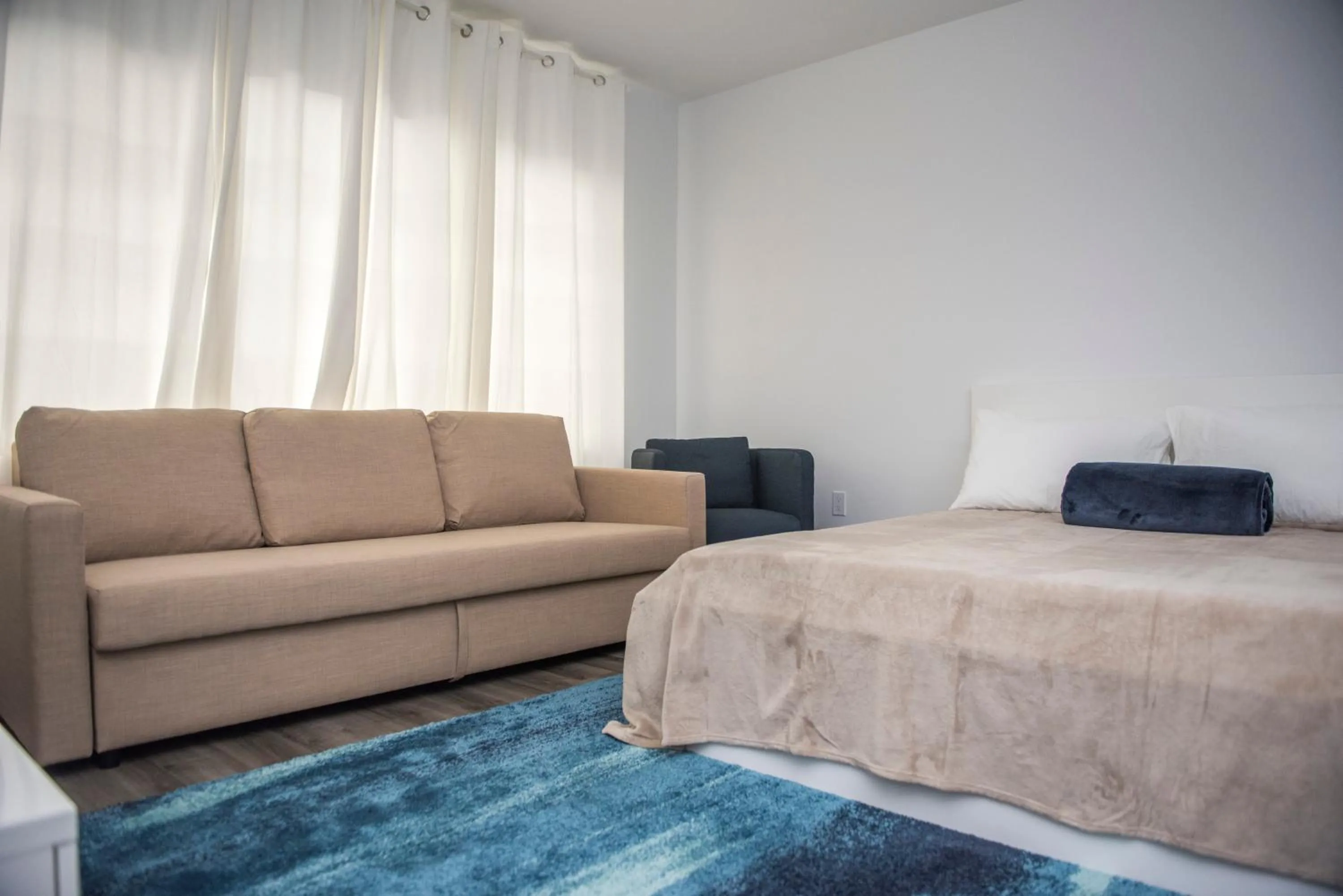 Seating Area in 12th & Ocean Suites by LuxUrban