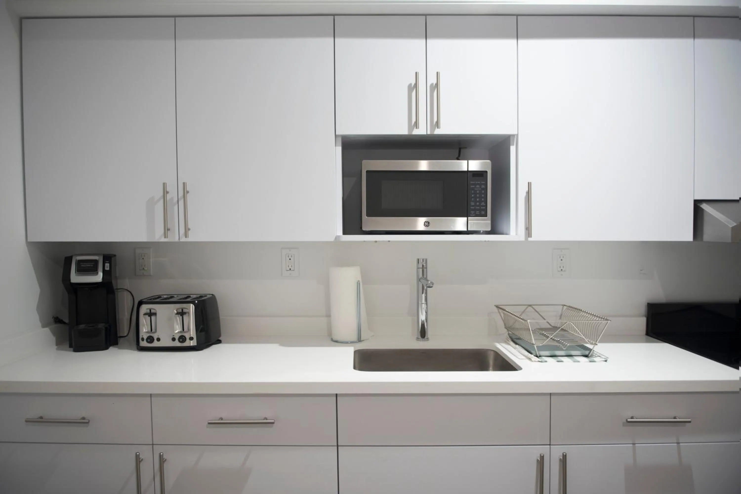 Kitchen/Kitchenette in 12th & Ocean Suites by LuxUrban