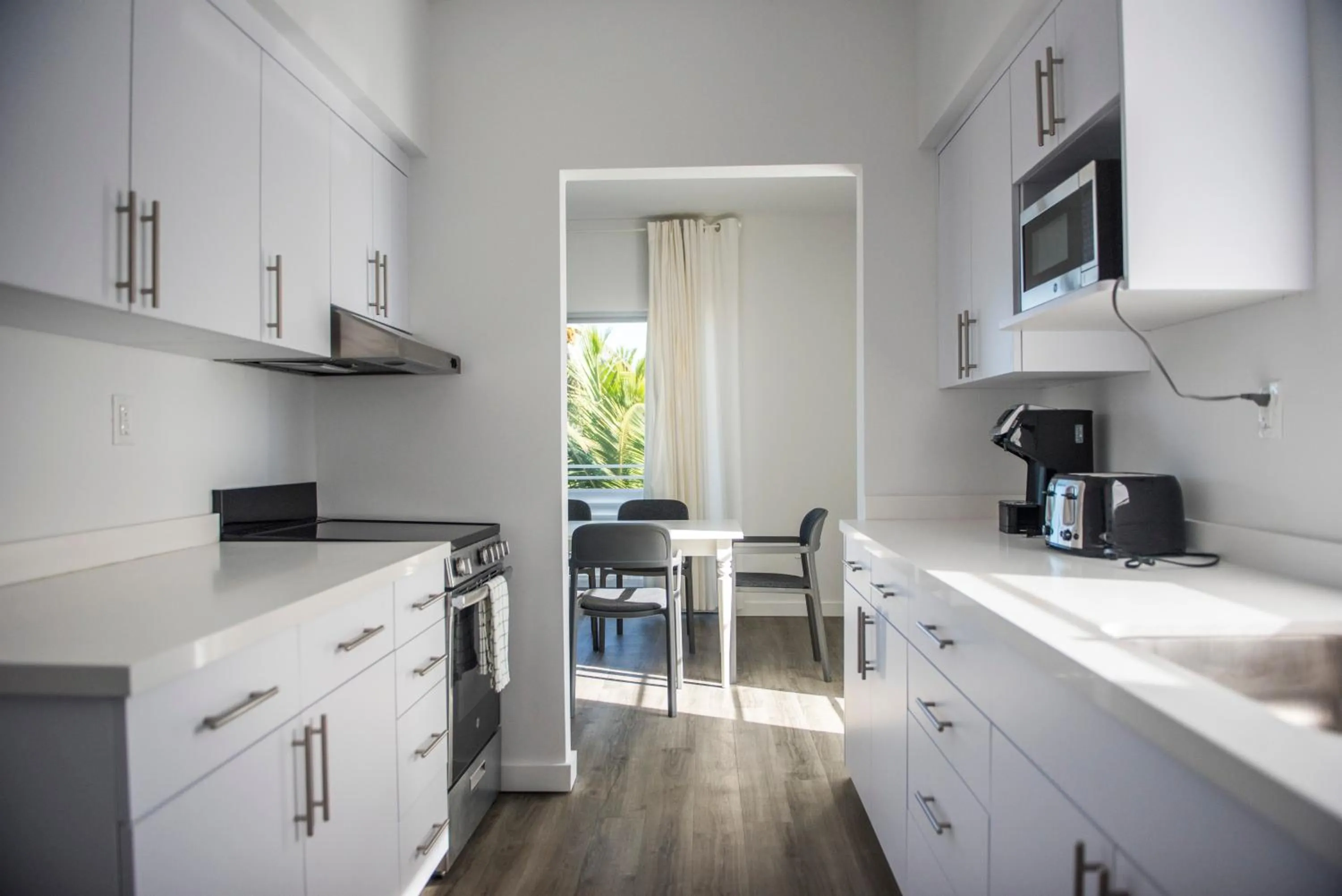 Kitchen/Kitchenette in 12th & Ocean Suites by LuxUrban