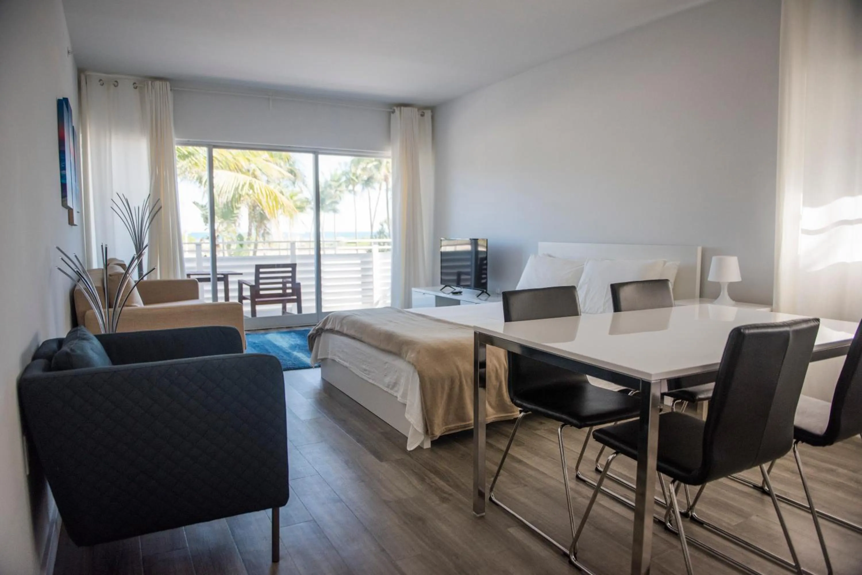 Seating Area in 12th & Ocean Suites by LuxUrban