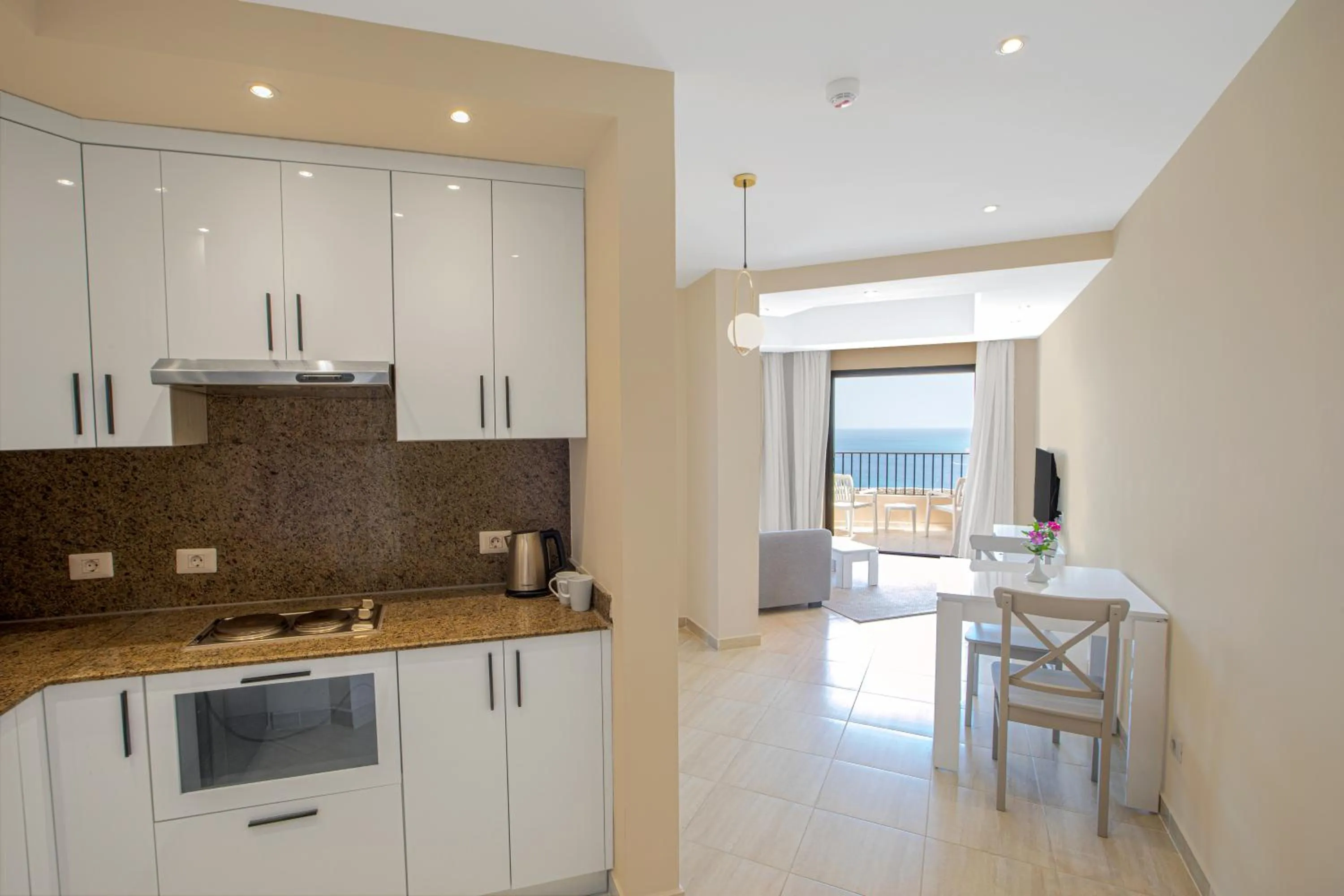 Kitchen or kitchenette in Sky View Suites Hotel