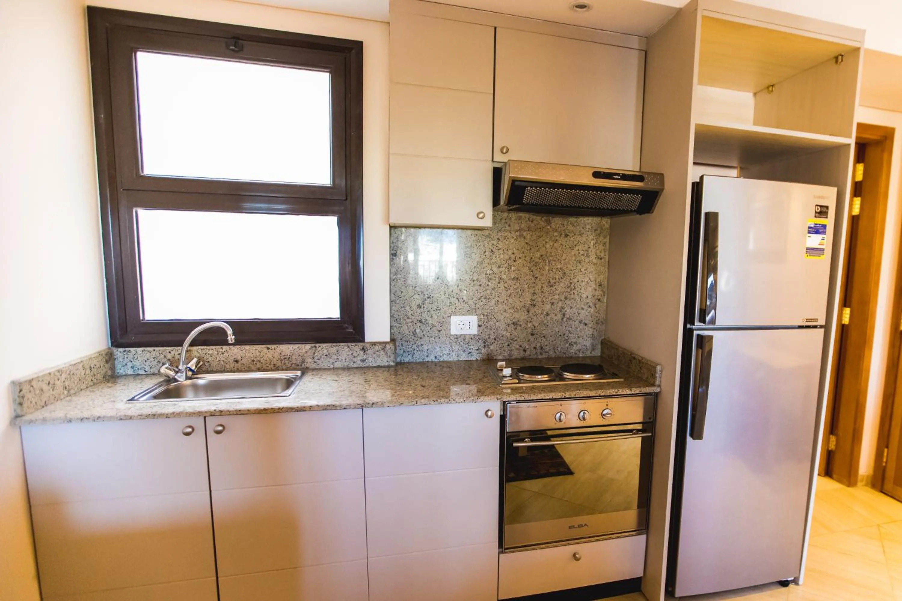 Kitchen or kitchenette in Sky View Suites Hotel