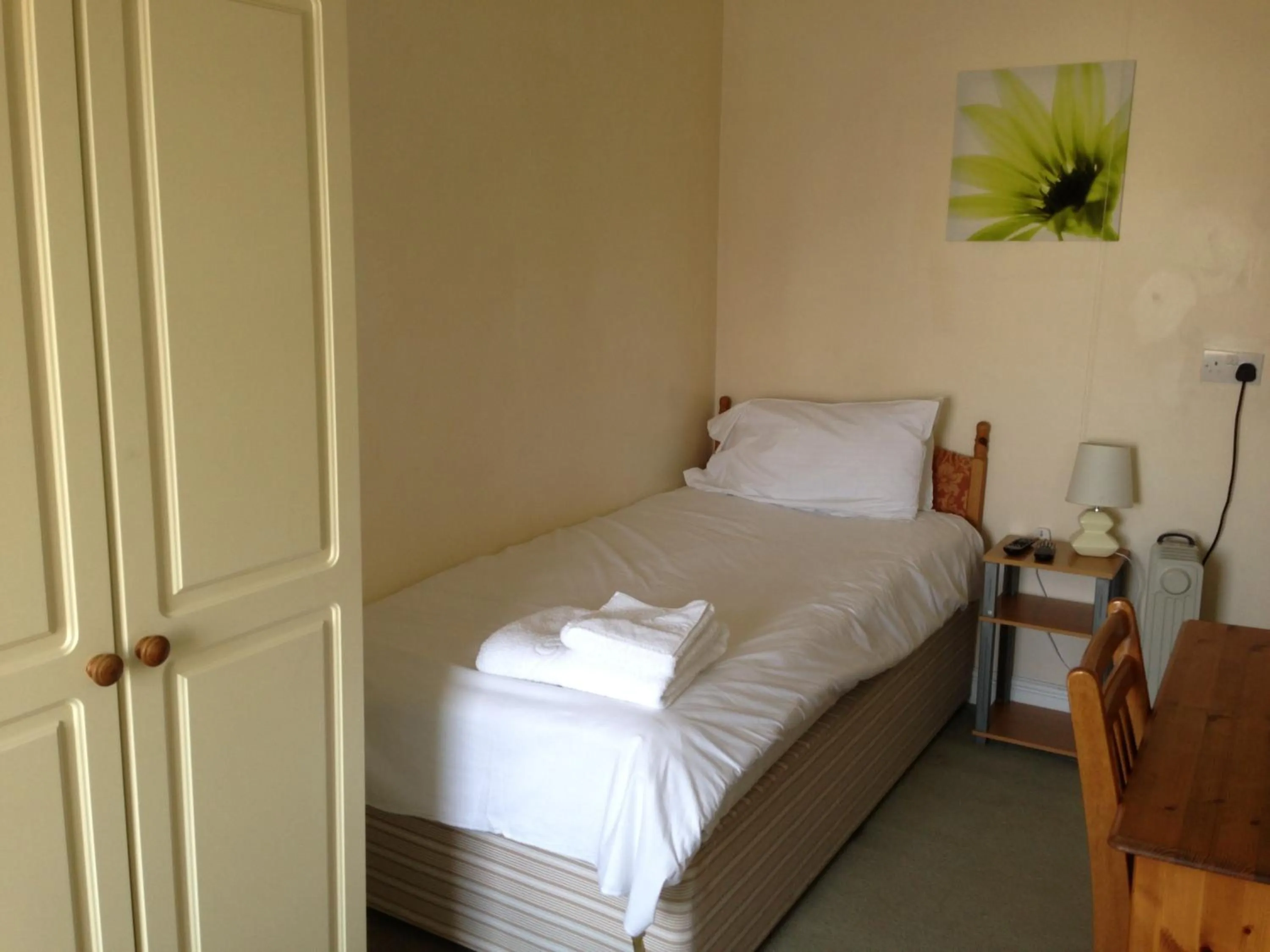 Bed in Ambrose Hotel