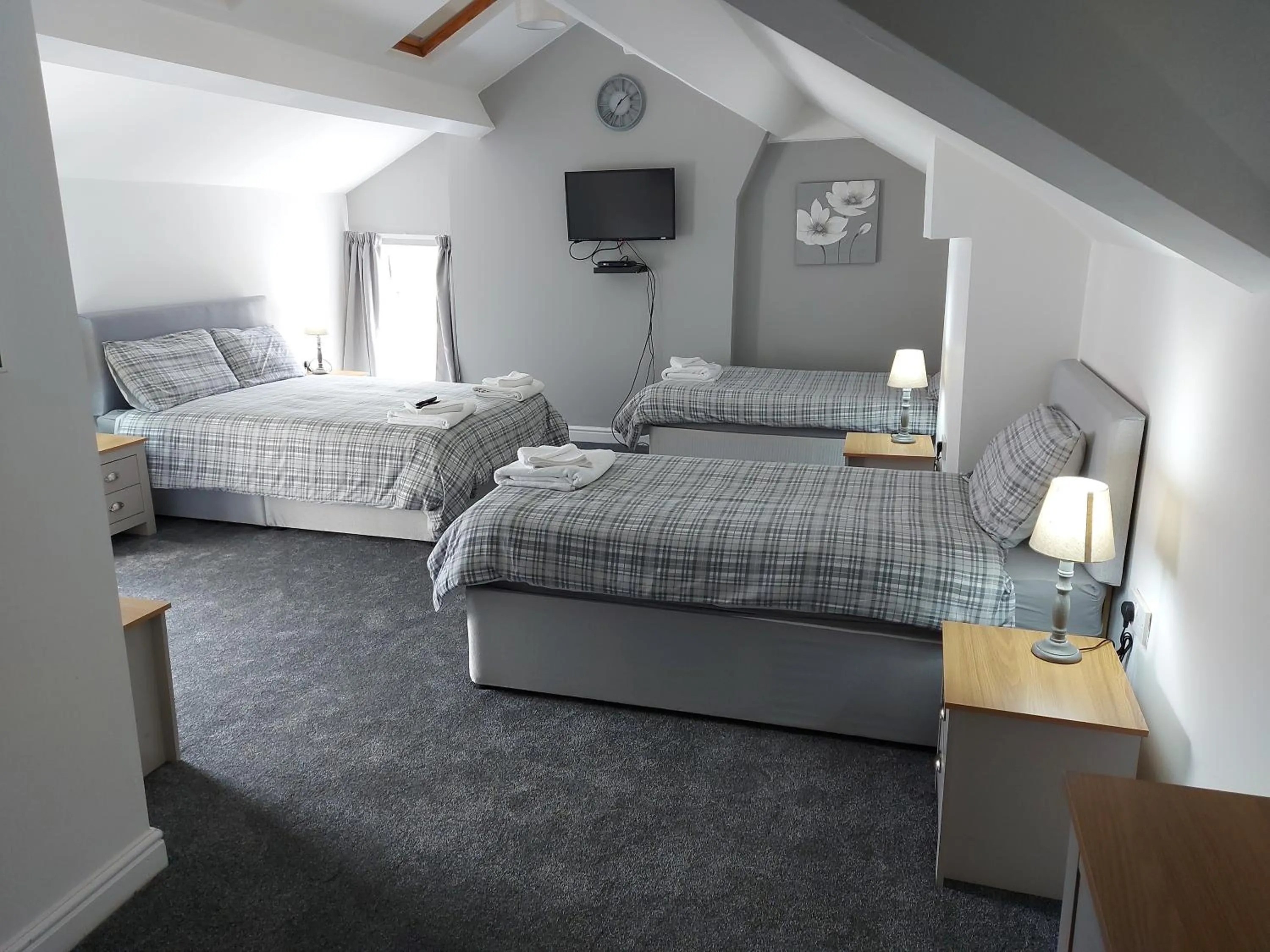 Bed in Ambrose Hotel