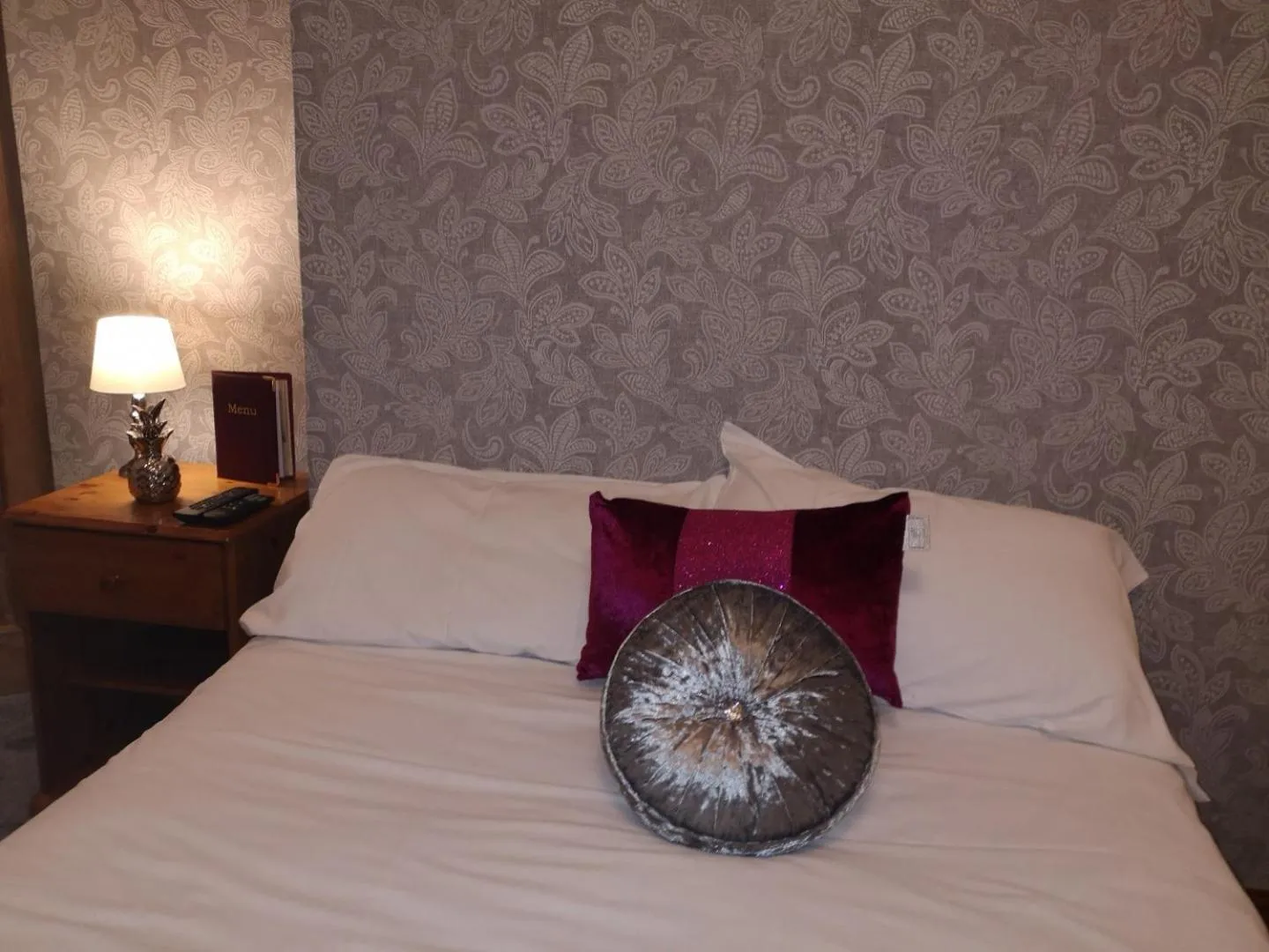 Bed in Ambrose Hotel